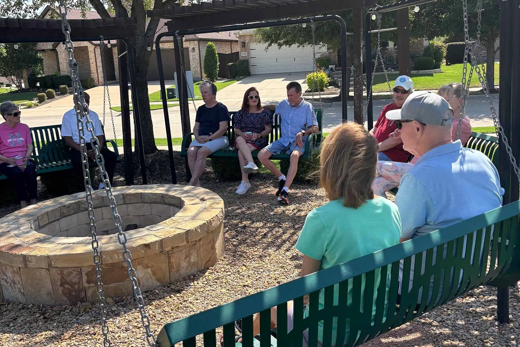 people-sitting-around-firepit-socializing