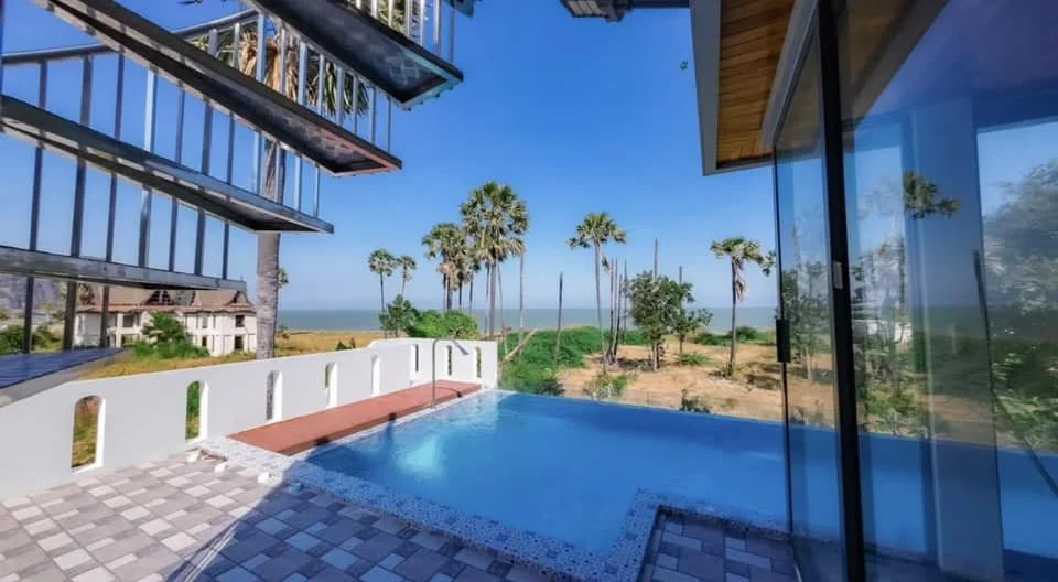 Pool Terrace: An elevated outdoor oasis centered around a crystal-clear private pool.