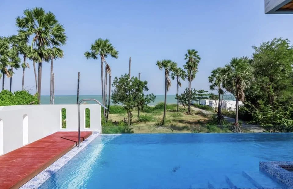 Infinity Pool Detail: The azure waters of the private pool appear to merge with the sea beyond.