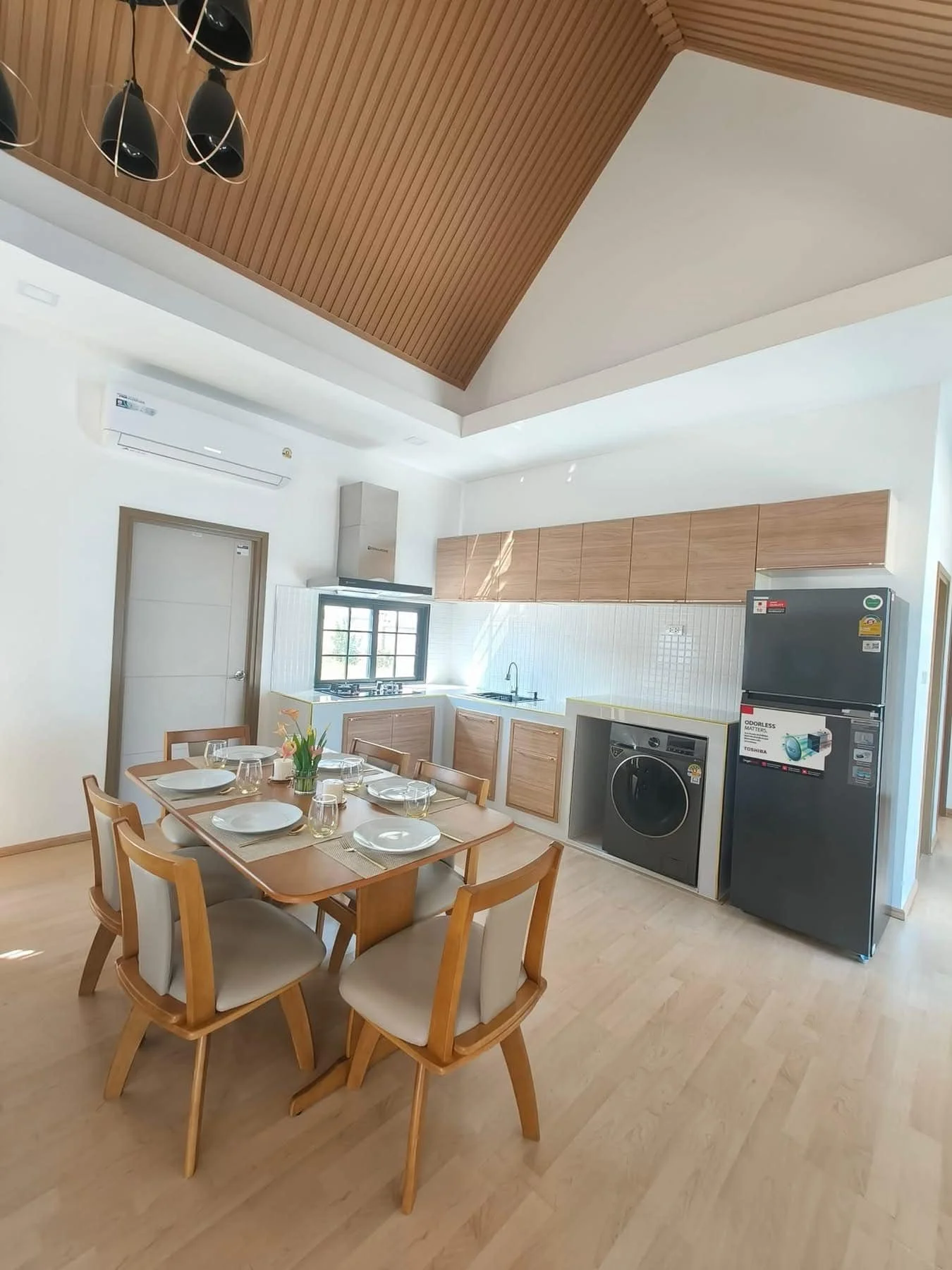 A high-angle view of the functional and chic L-shaped kitchen.