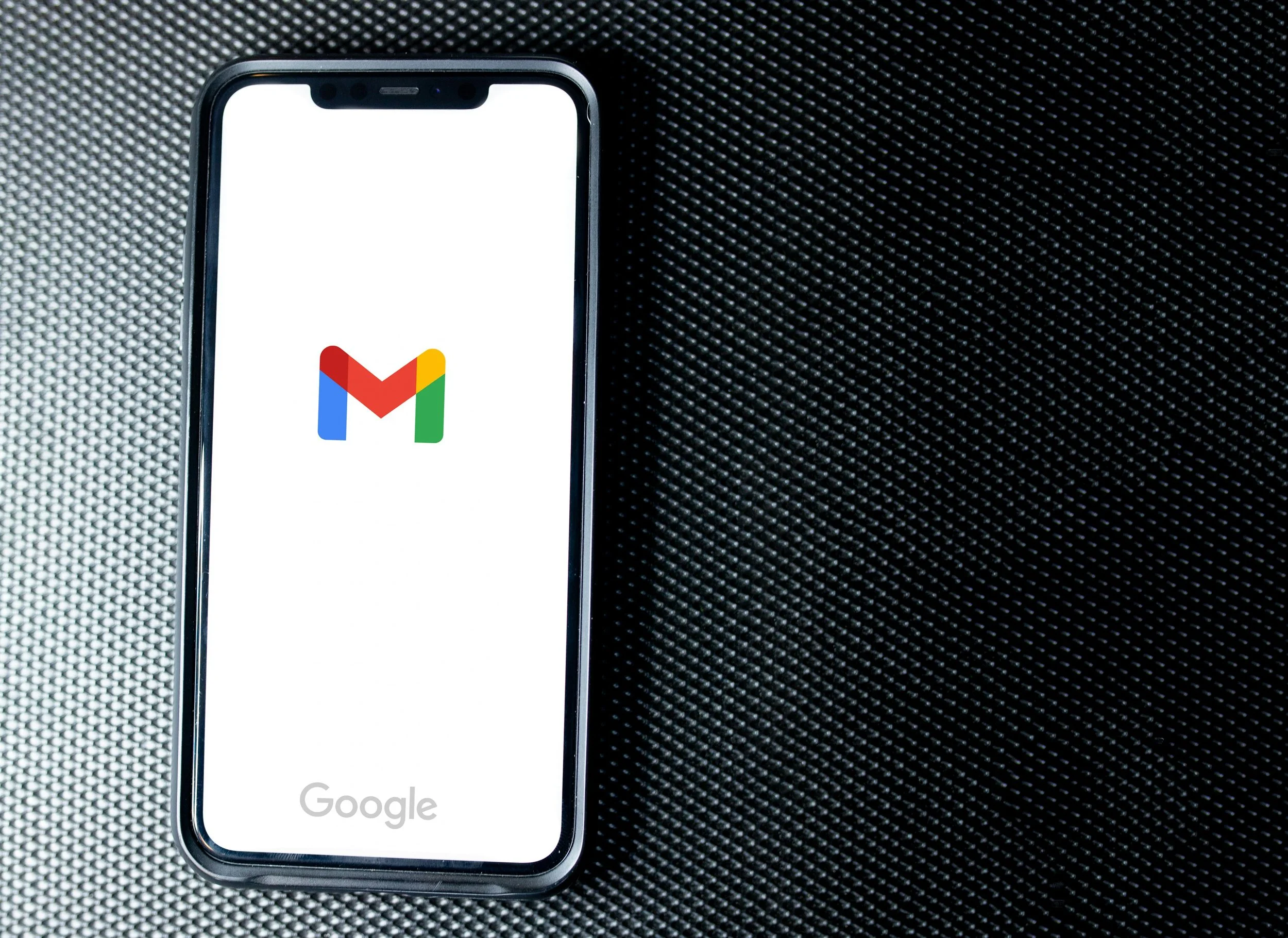 Smartphone displaying Gmail, representing easy email contact for appliance repair requests