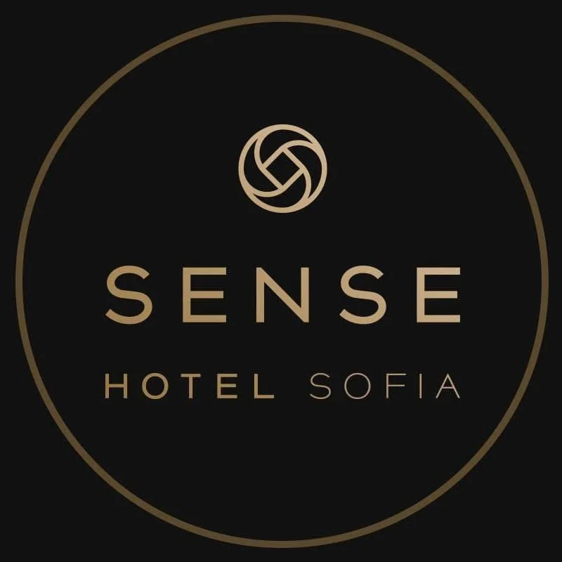 Logo for Sense Hotel Sofia on a black background with a gold circular border and gold text.