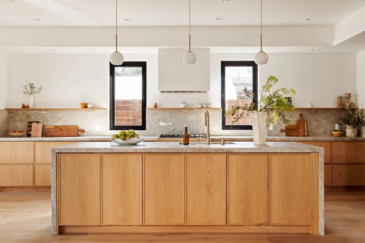 Light oak cabinetry and natural stone in JBG’s Lyceum Avenue kitchen