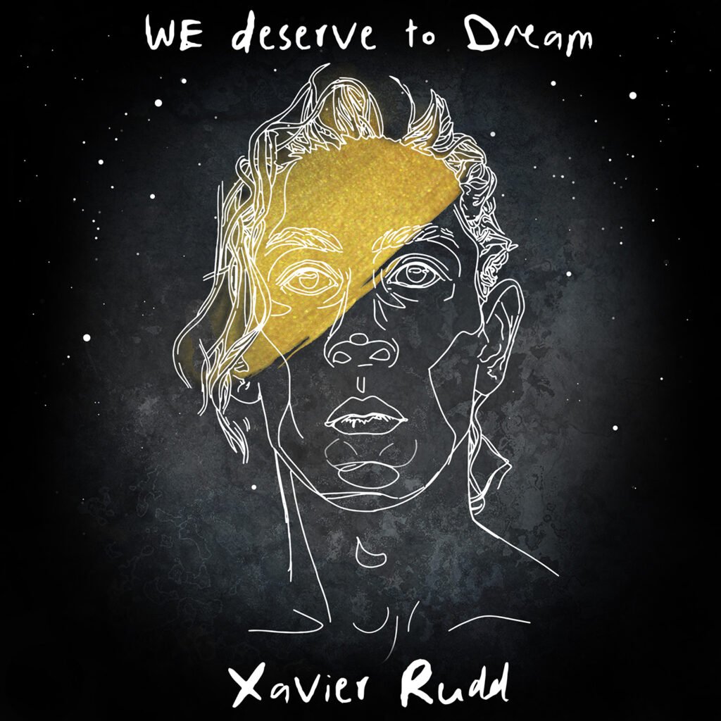 Line art drawing of a person's face with a yellow section over the upper left part of the face, set against a dark background with white speckles. The text at the top says, "WE deserve to Dream" and the bottom says, "Xavier Rudd."