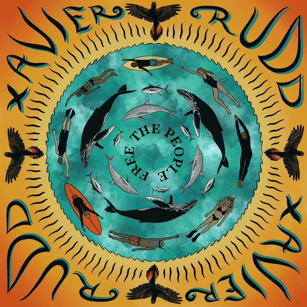 Illustration of whales, dolphins, and people swimming or surfing in a circular pattern inside a turquoise water circle, with the words "Vive le Sud" and "Free the People" around the border and birds flying outside the circle.