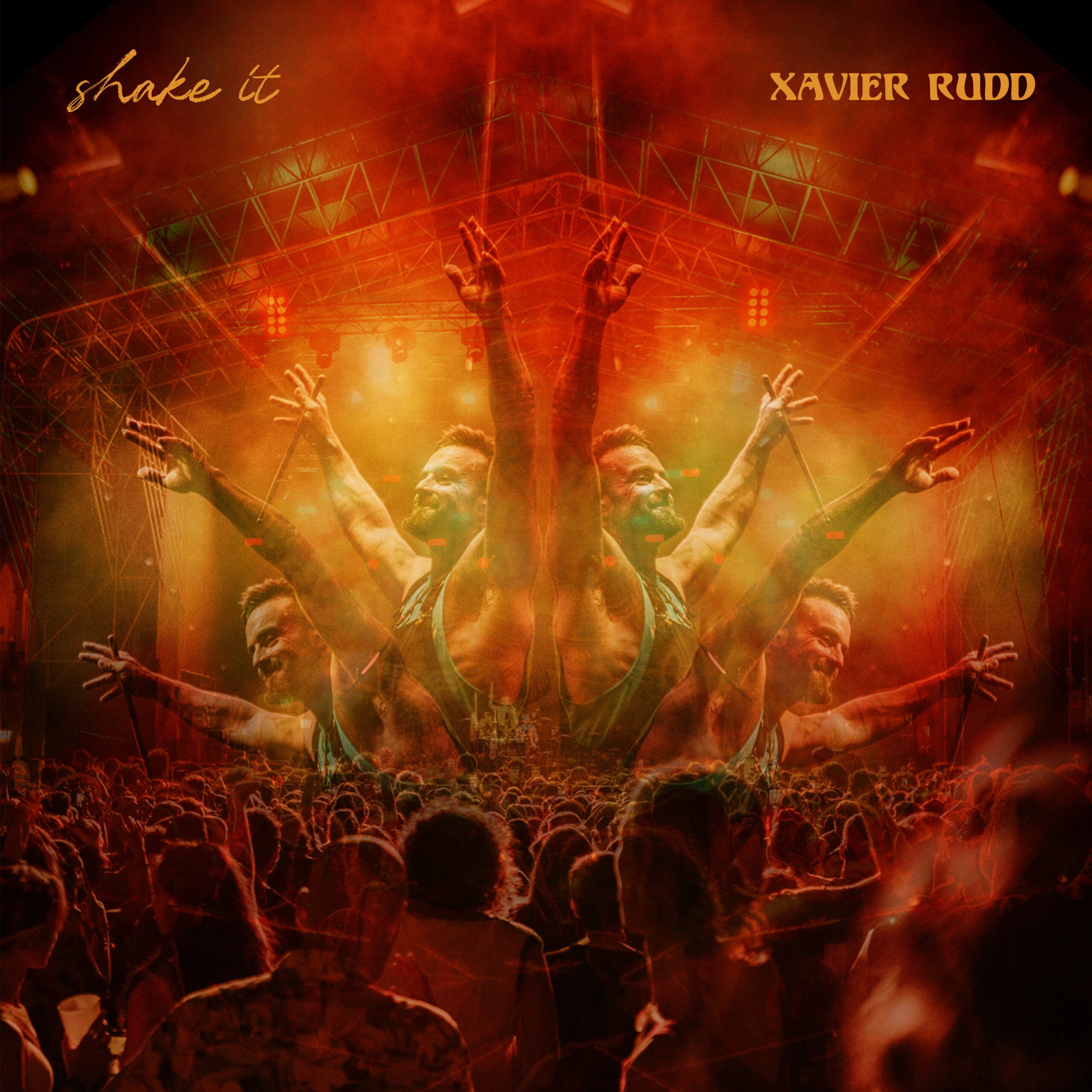 Concert scene with a large crowd, a stage with bright orange and yellow lighting, and a performer in a tank top raising his arms. The image has a layered, duplicated, and mirrored effect. Text reads "shake it" in the top left corner and "XAVIER RUDD"