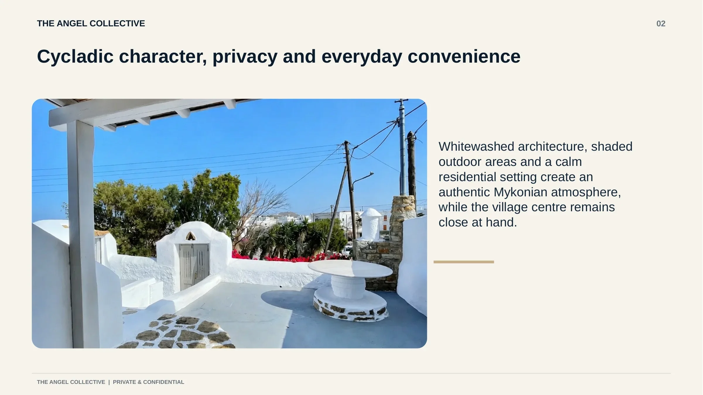 Private Cycladic courtyard with whitewashed walls, stone paving and shaded outdoor areas.