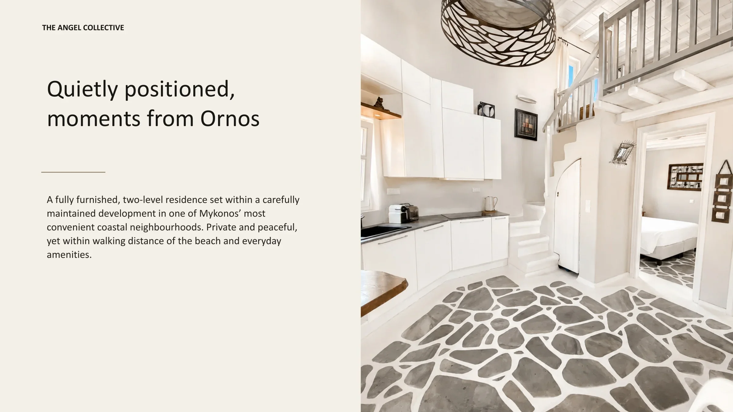 Private two-level residence near Ornos Beach featuring whitewashed interiors and traditional Mykonian stone flooring.