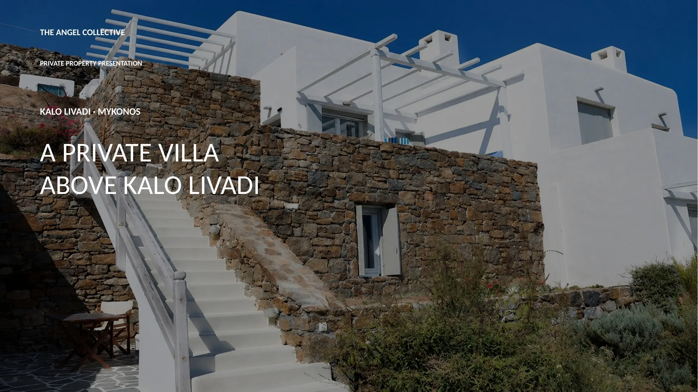 Private hillside villa above Kalo Livadi, Mykonos, featuring whitewashed Cycladic architecture and natural stone.