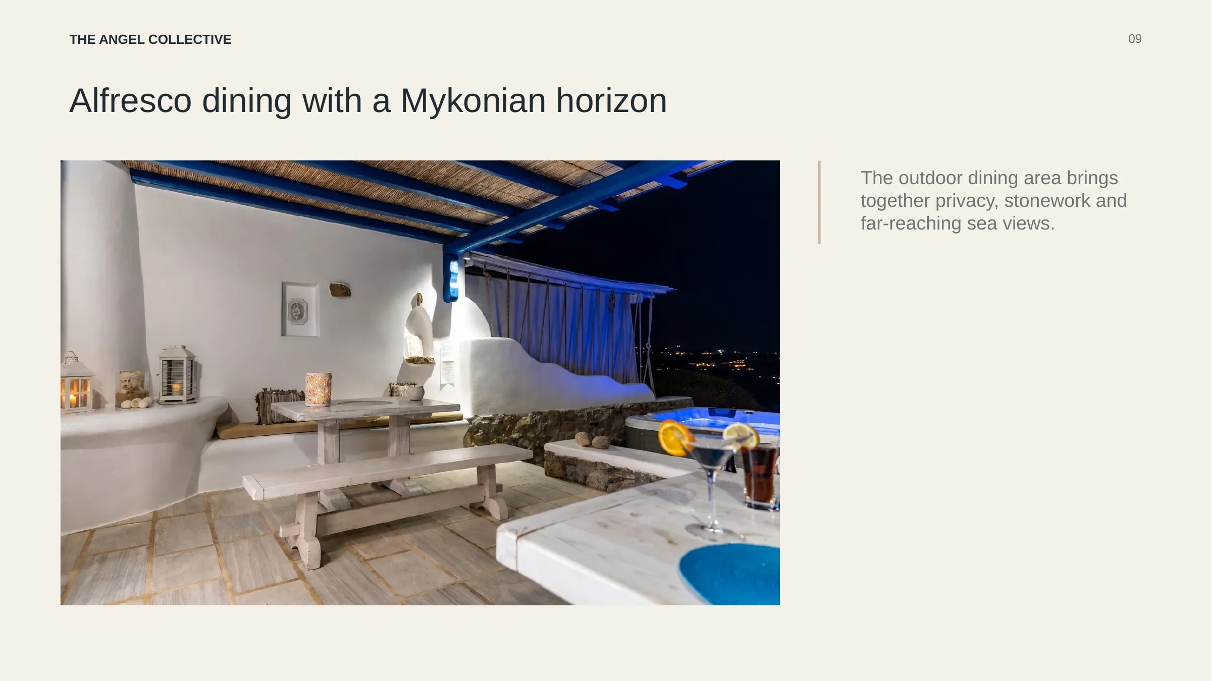 Private alfresco dining terrace combining traditional stonework with panoramic Mykonos sea views.