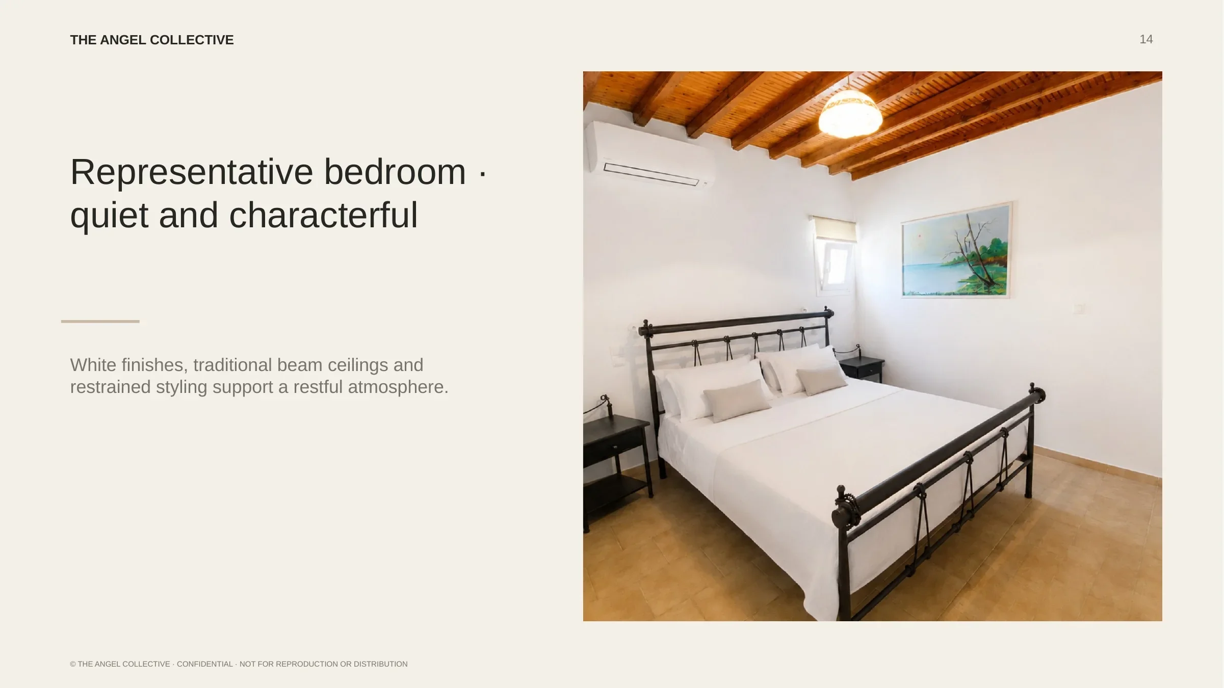 Quiet double bedroom with white finishes, traditional timber beams and restrained island styling.