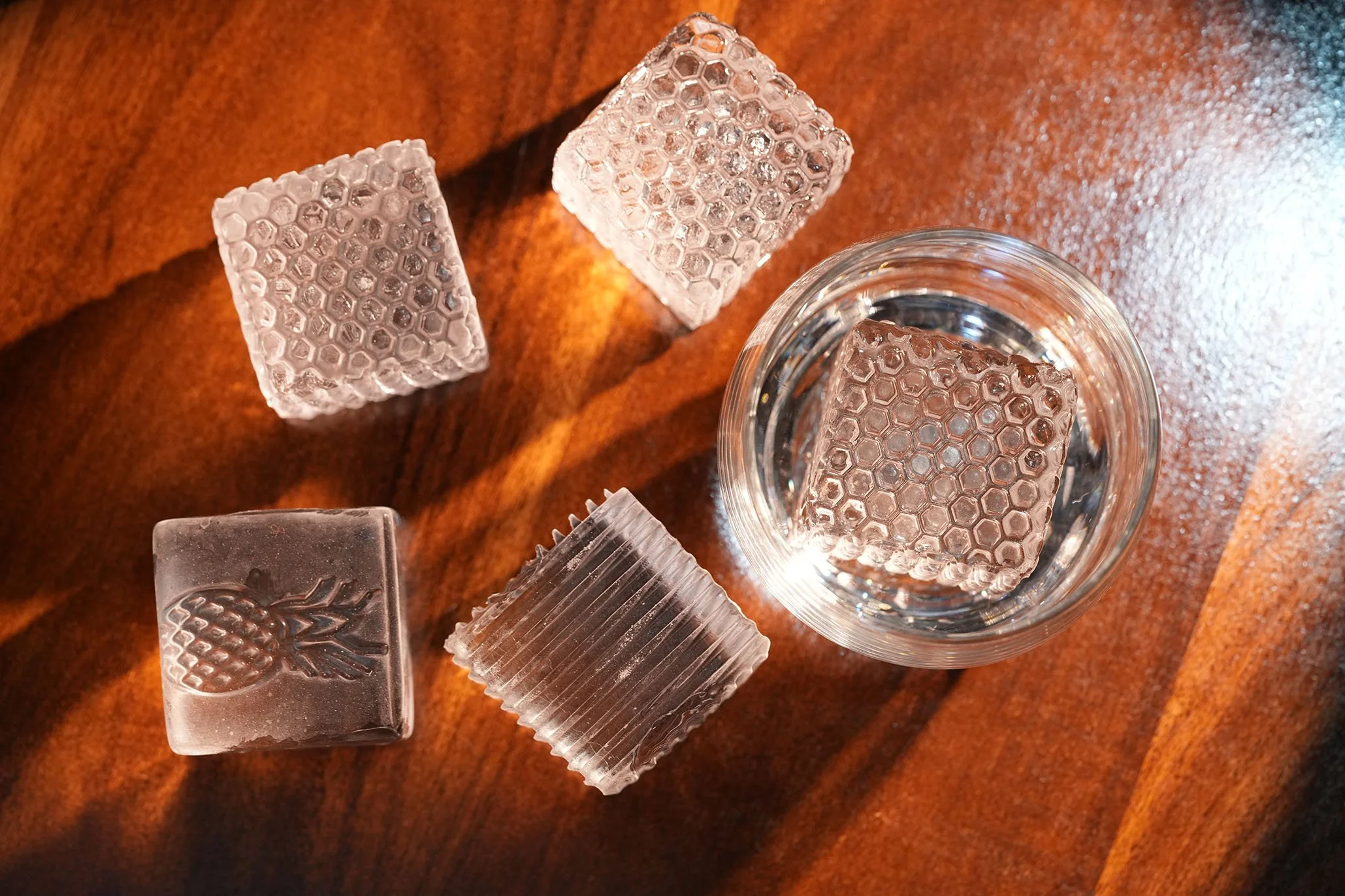 Custom-patterned and imprinted clear ice for distinctive branded presentation