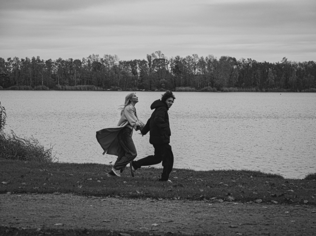couple walking by a lake reflecting on life memories together