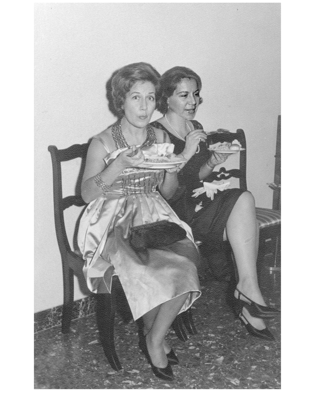 photograph of two women sitting on a chair. the photo captures a story of a past life