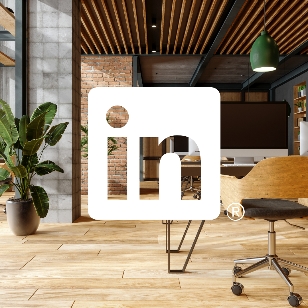 Modern office interior with plants, wooden furniture, and brick wall.