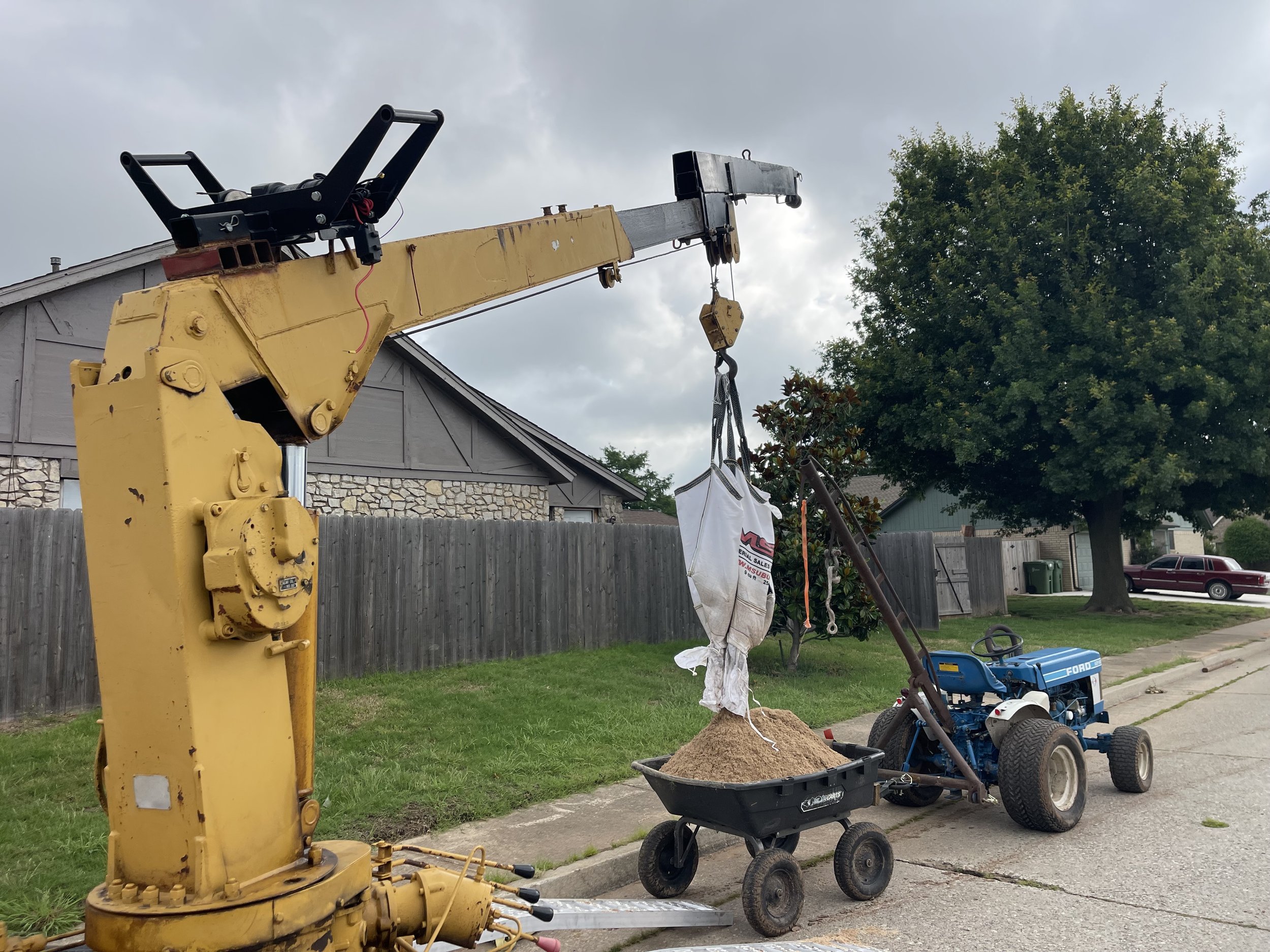 Delivering sand to a clients backyard 