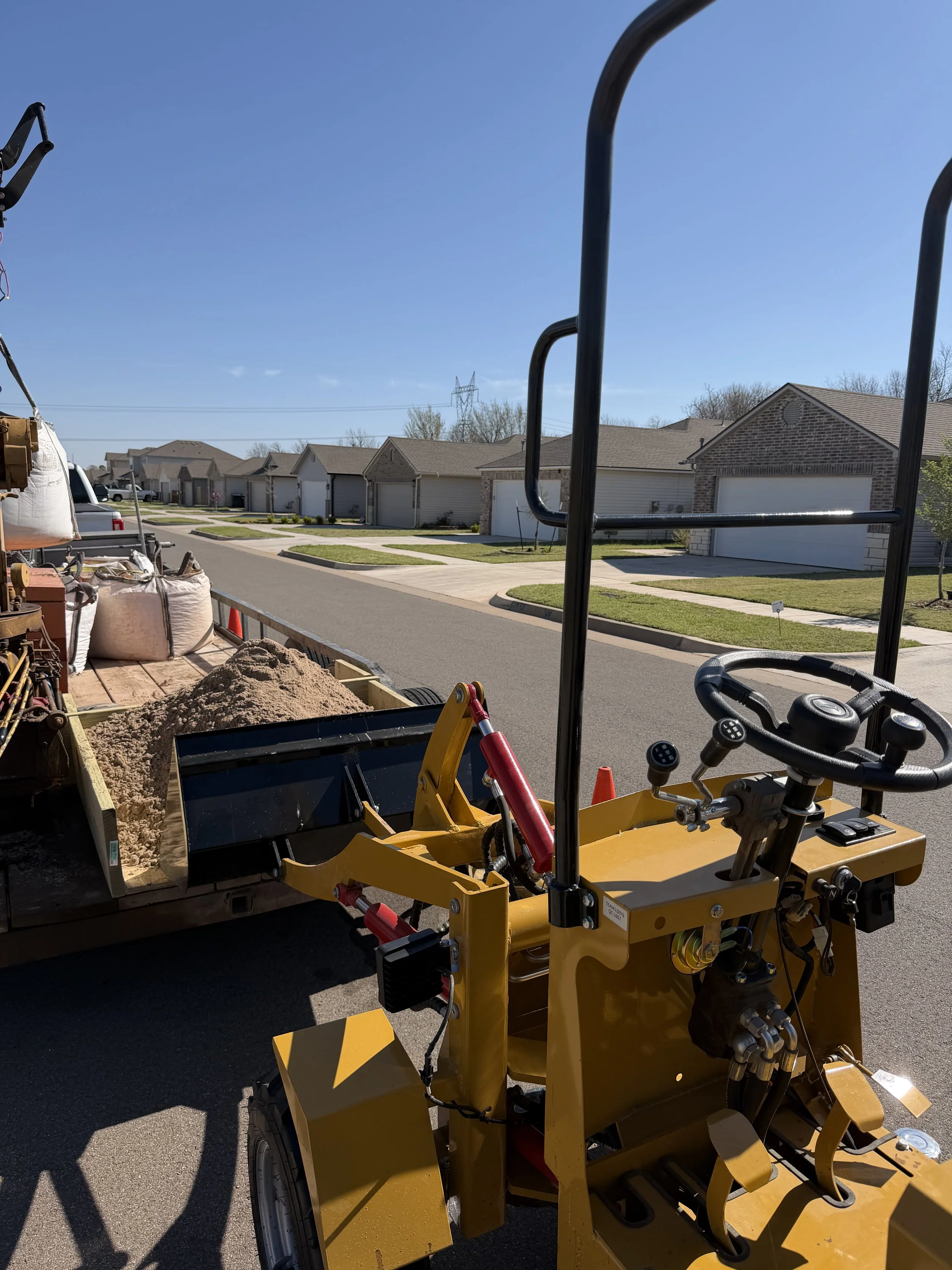 Delivering sand to a clients backyard 