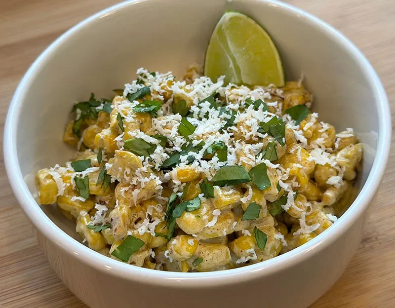 Elote or street corn with lime wedge
