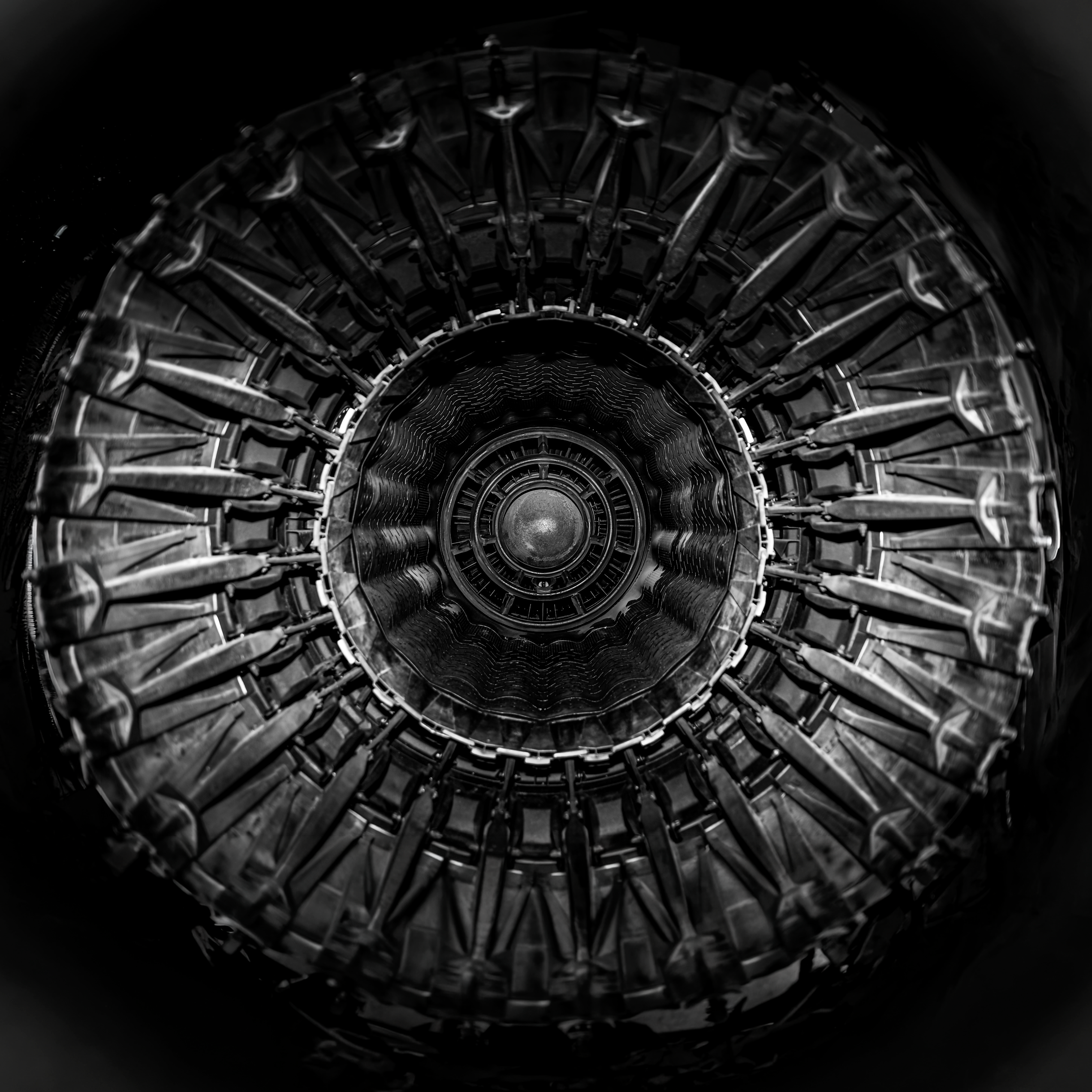 View from inside a jet engine, showing the intricate turbine blades and components.