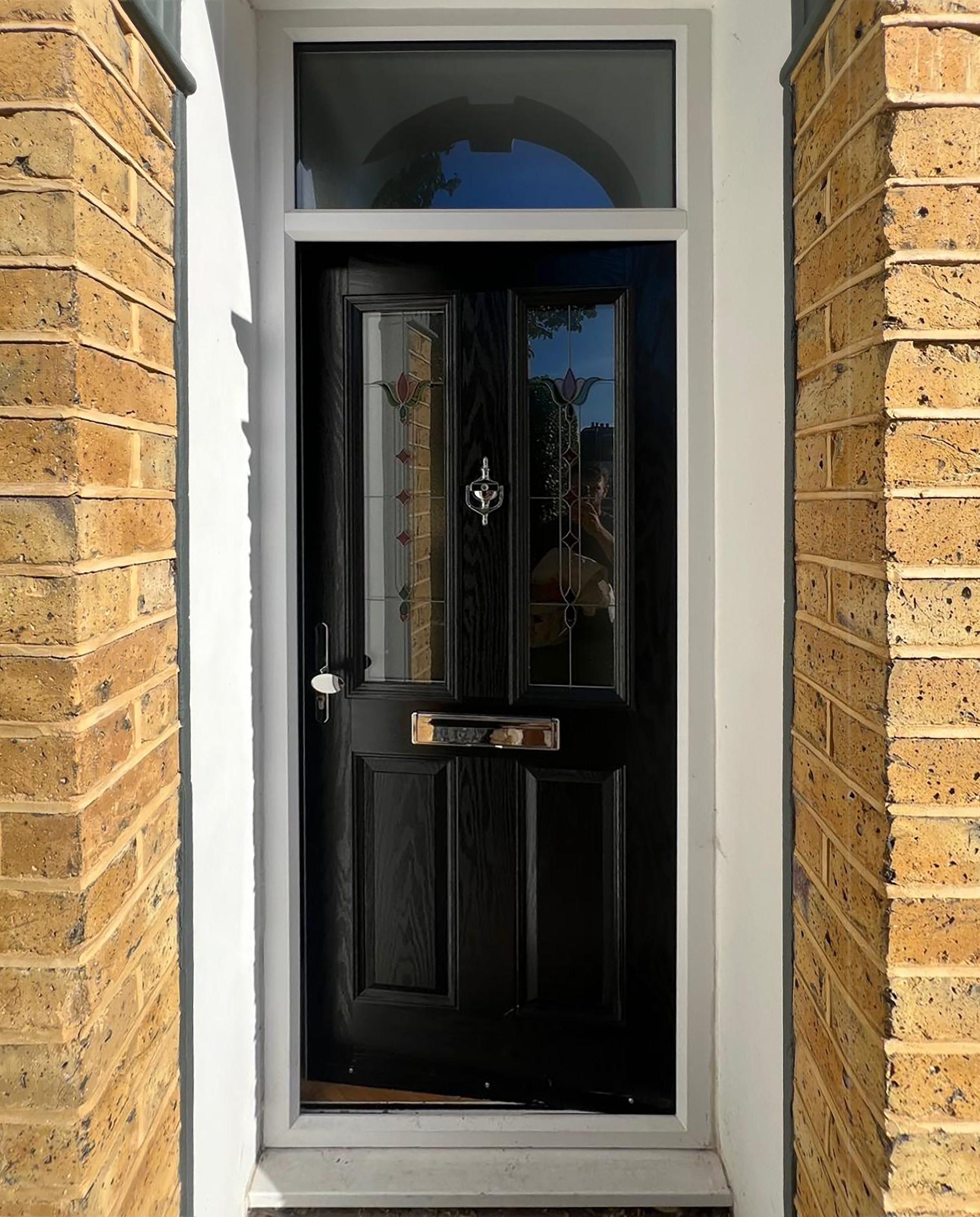 before picture of Front door of a house painted black
