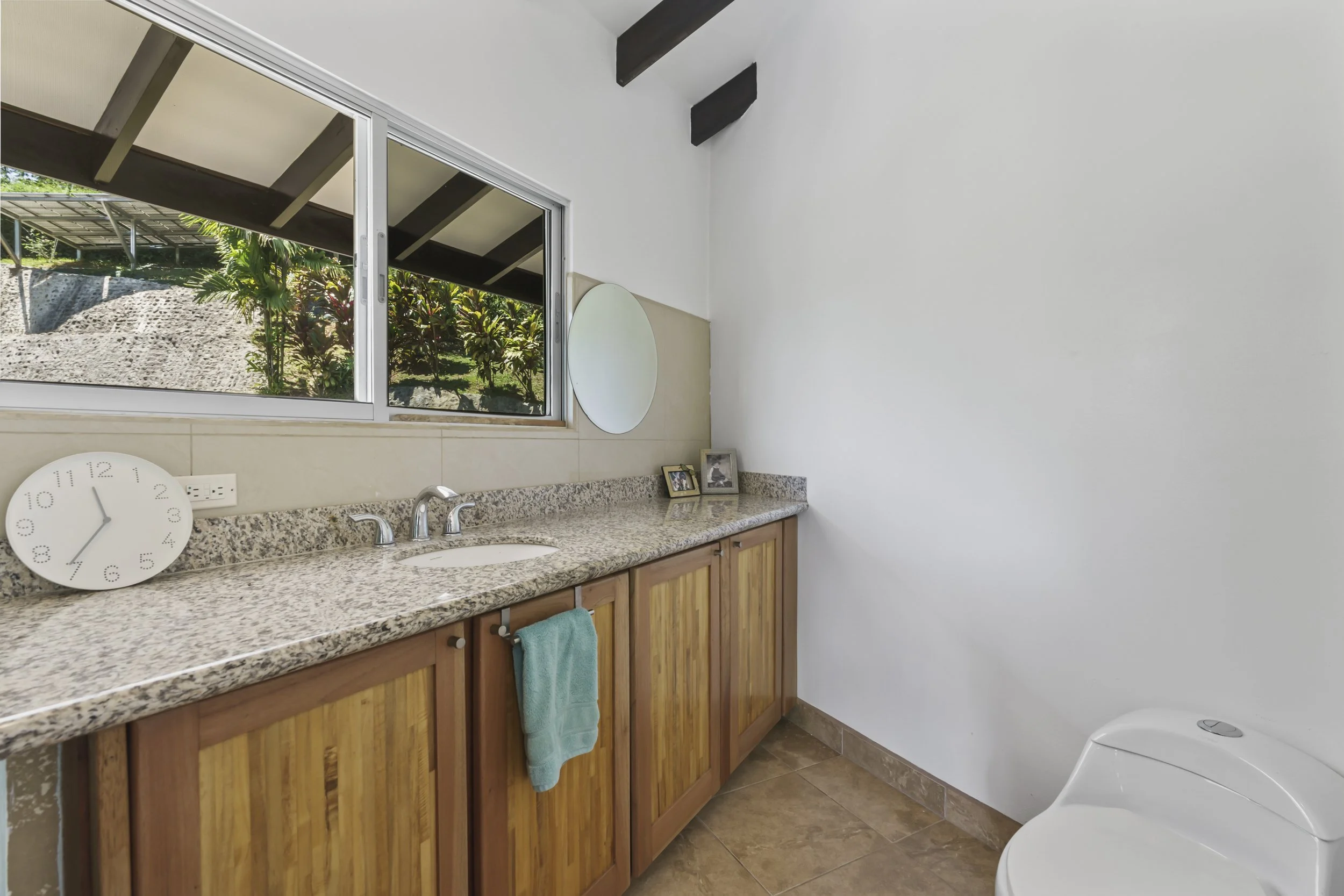 Ensuite bathroom of the second primary suite featuring modern finishes.
