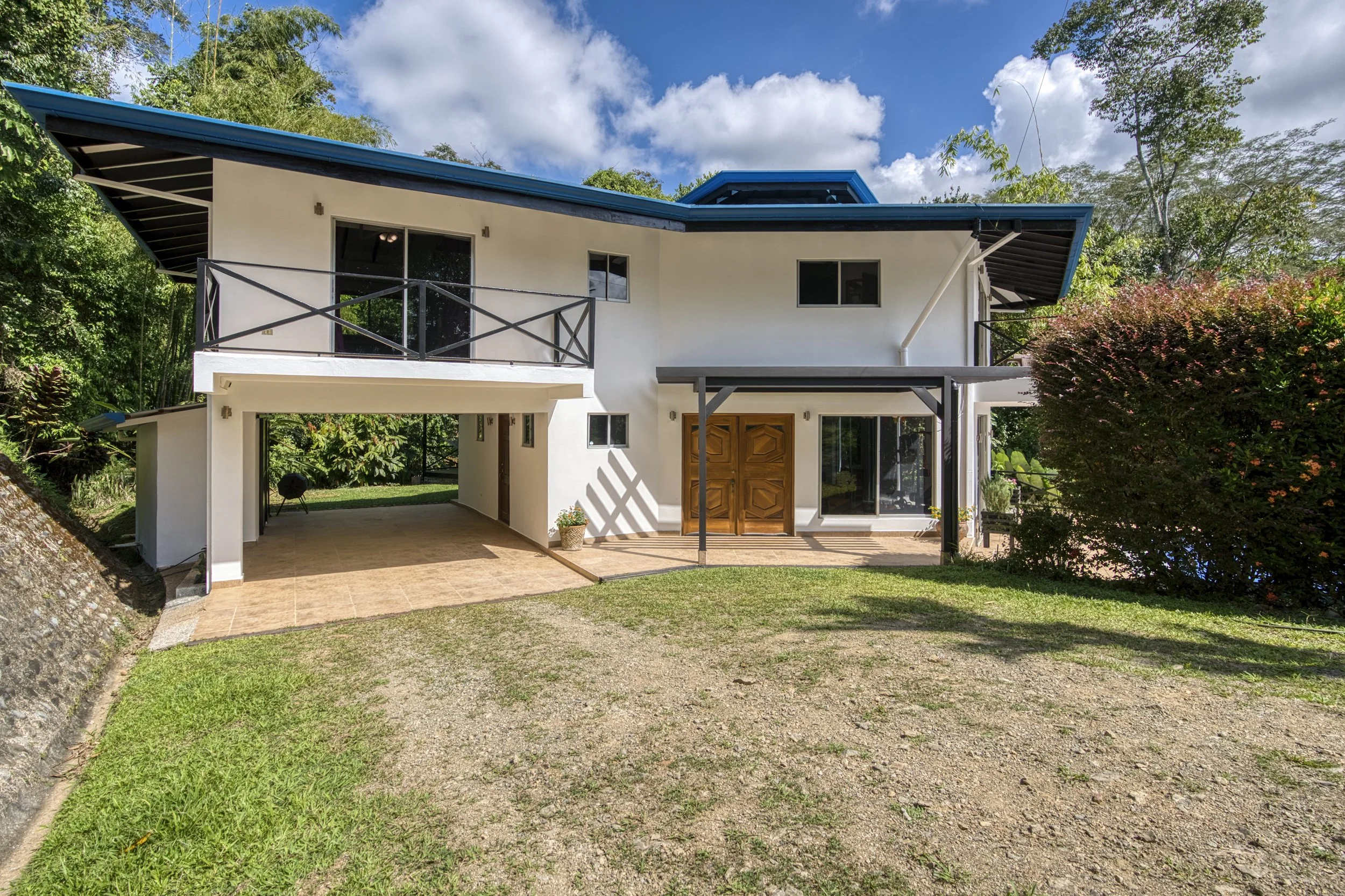 The modern home design is both luxurious and practical while giving a nod to traditional tropical architecture.