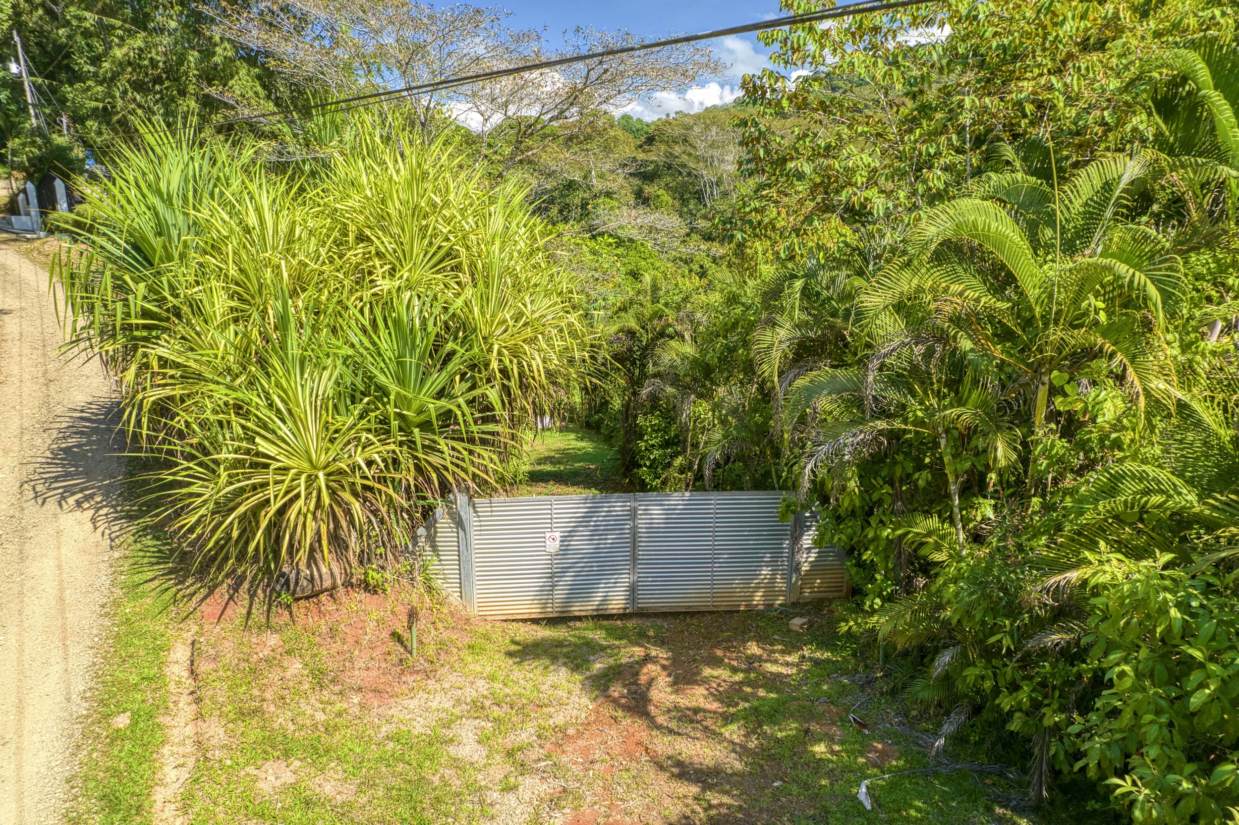 Private gate from the road providing access to the second titled lot at Casa Arbol de Vida.