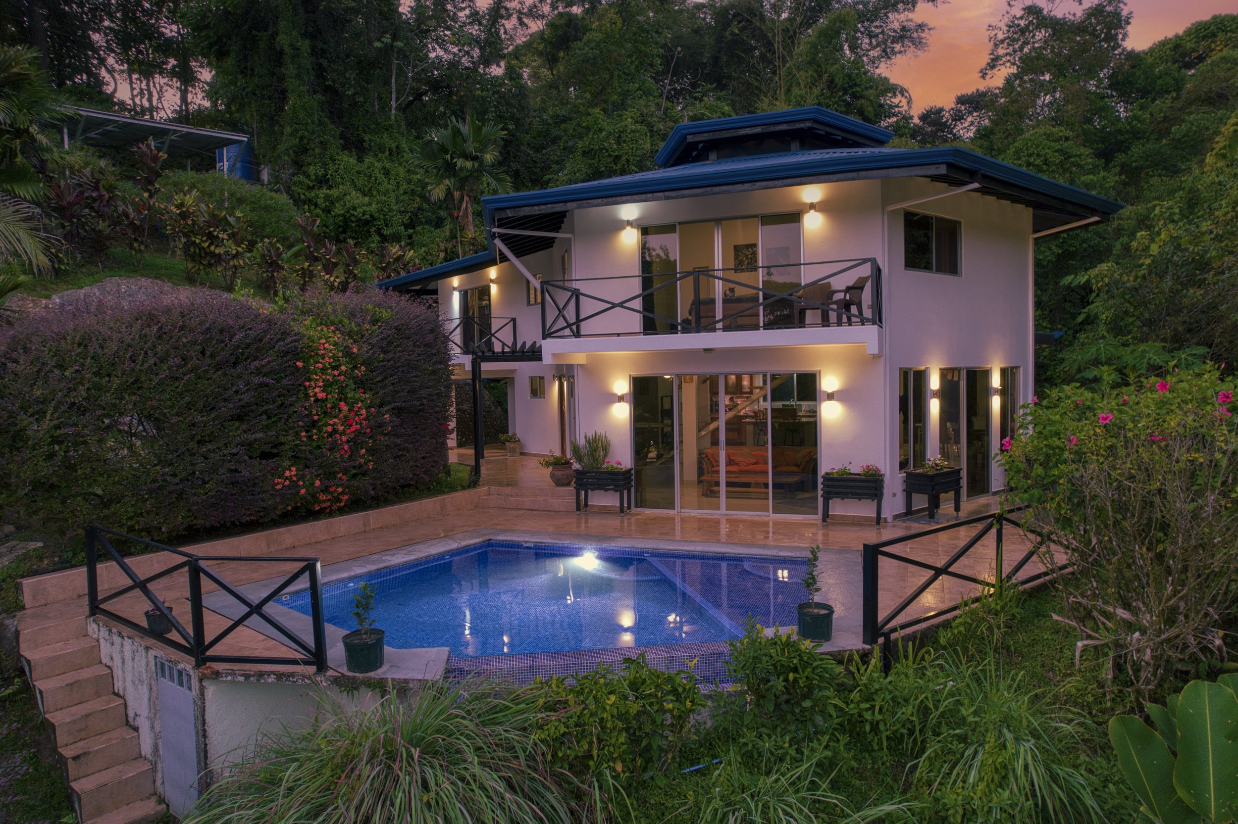 Pool deck and lounging space at dusk capturing the relaxed lifestyle of Costa Rica’s southern zone.