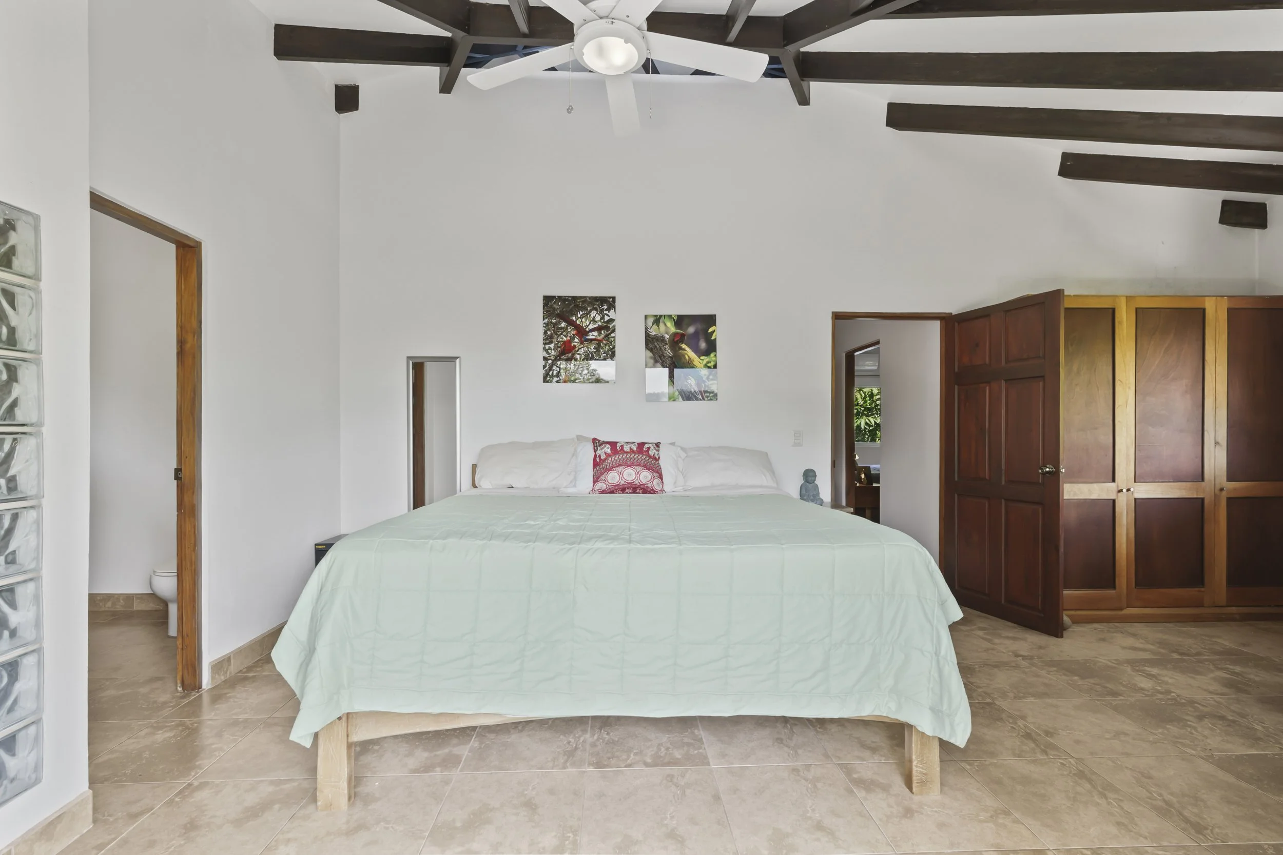 Natural light filling the interior spaces of Casa Arbol de Vida. The second primary suite features air flow that exits the cupola. This room also features a built in wood closet. This king sized bed is included with the home.