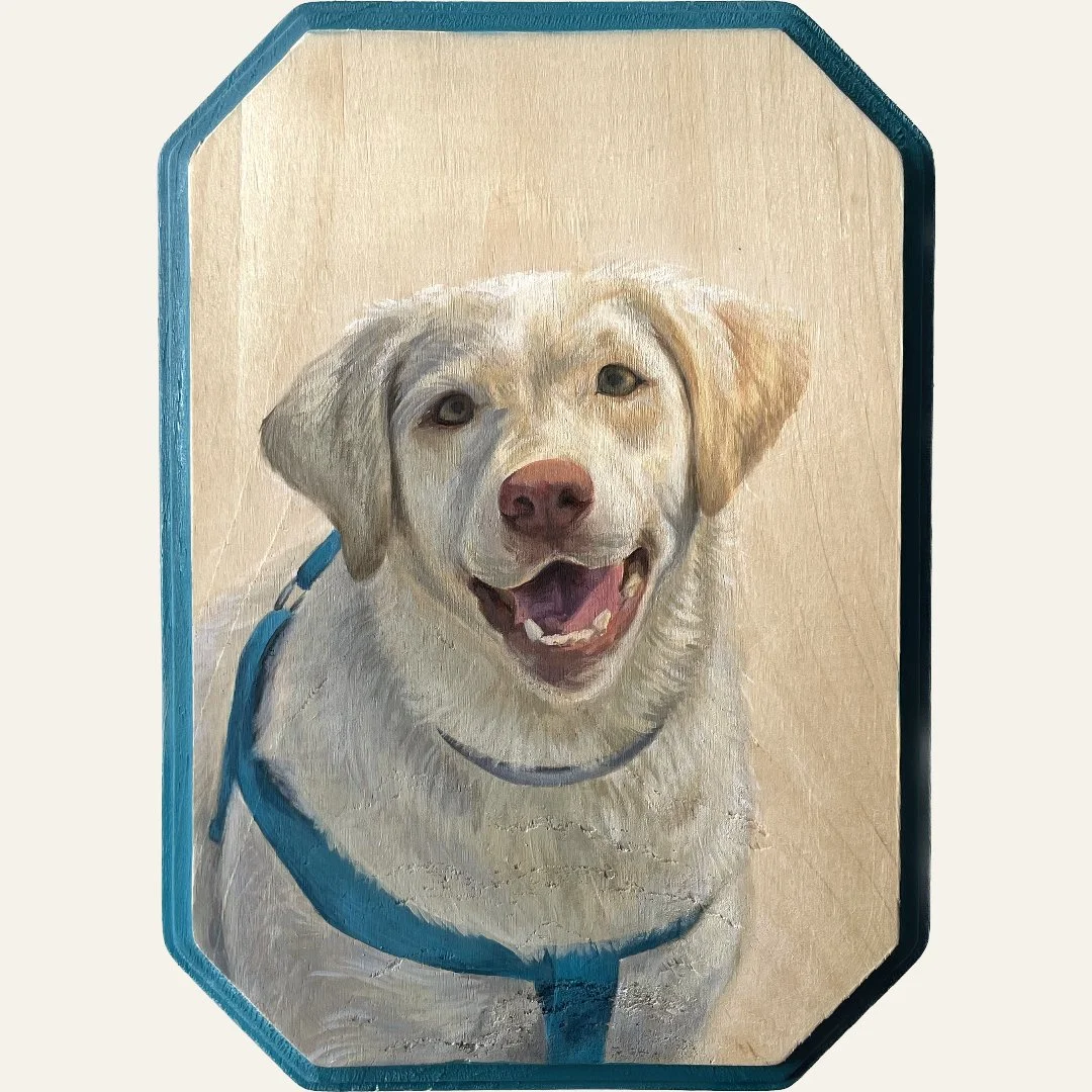 Painting of a happy yellow Labrador retriever wearing a blue harness, smiling.