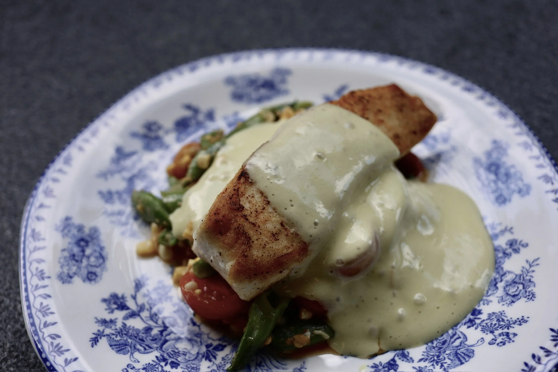 seared alaskan HALIBUT over a summer roma bean succotash & a whipped basil beurre blanc