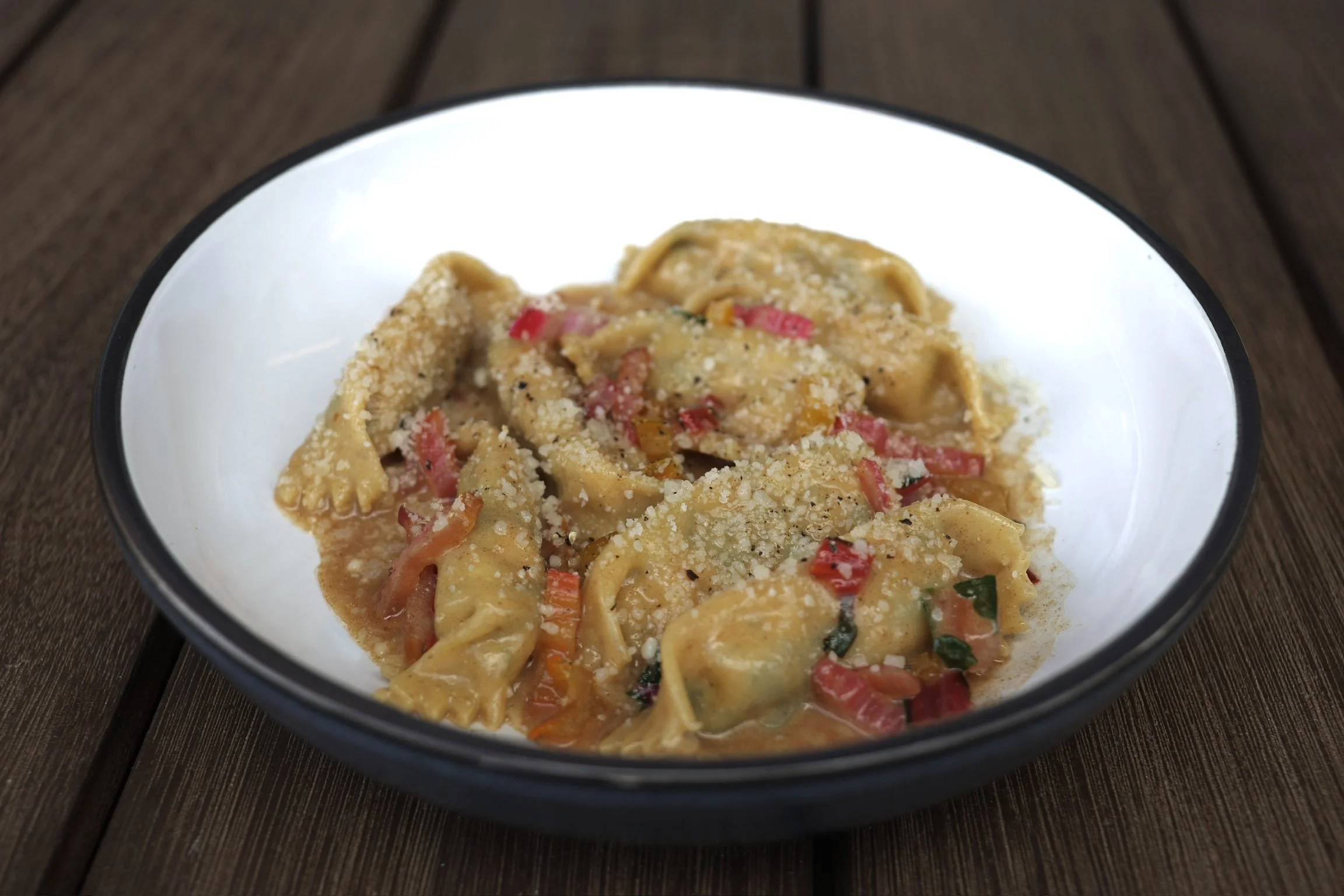 chicken & swiss chard filled AGNOLOTTI in a nutty brown butter chicken sauce with pecorino romano & black pepper 