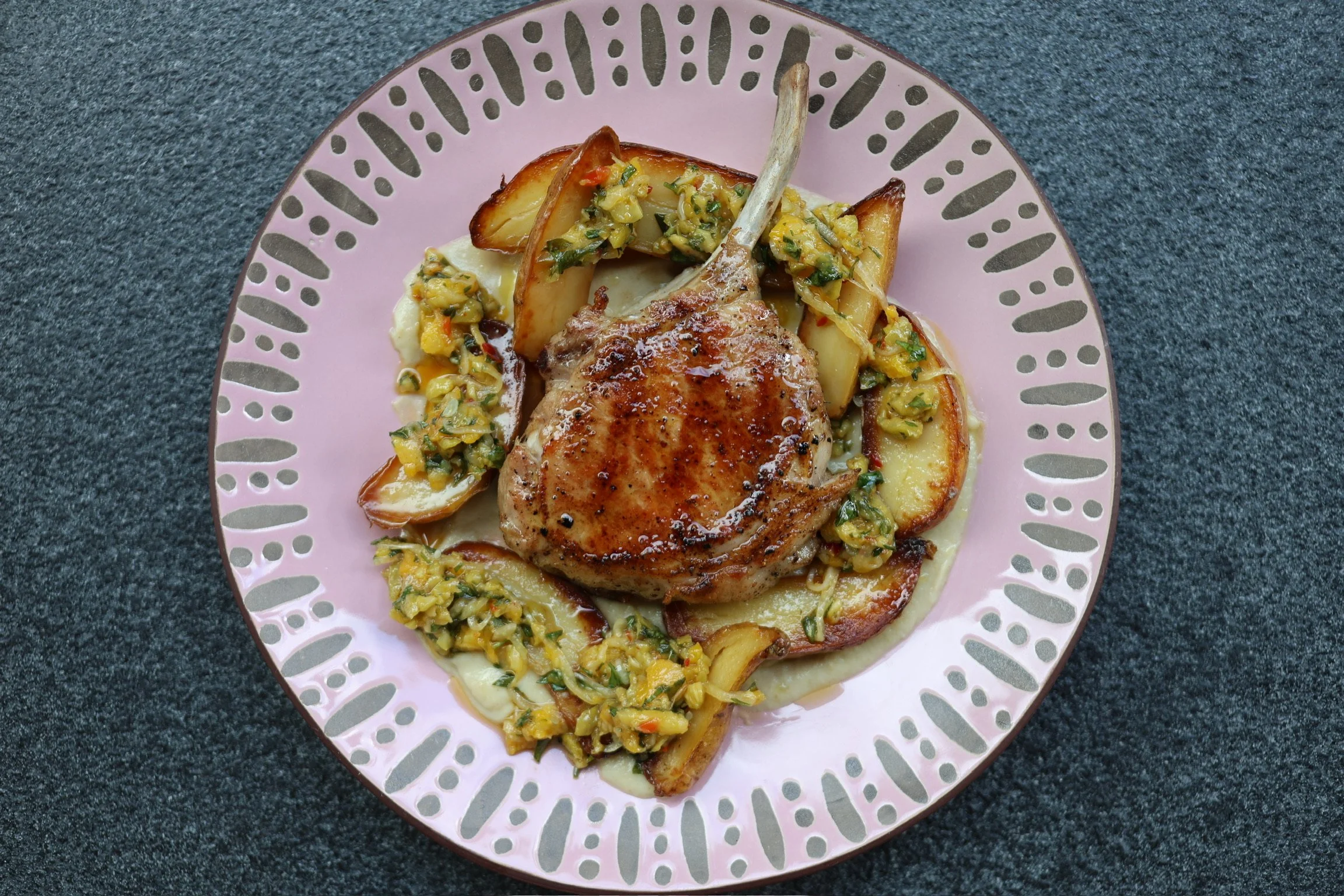 thick-cut berkshire PORK CHOP with confit fingerling potatoes, charred eggplant puree & pickled apricot relish