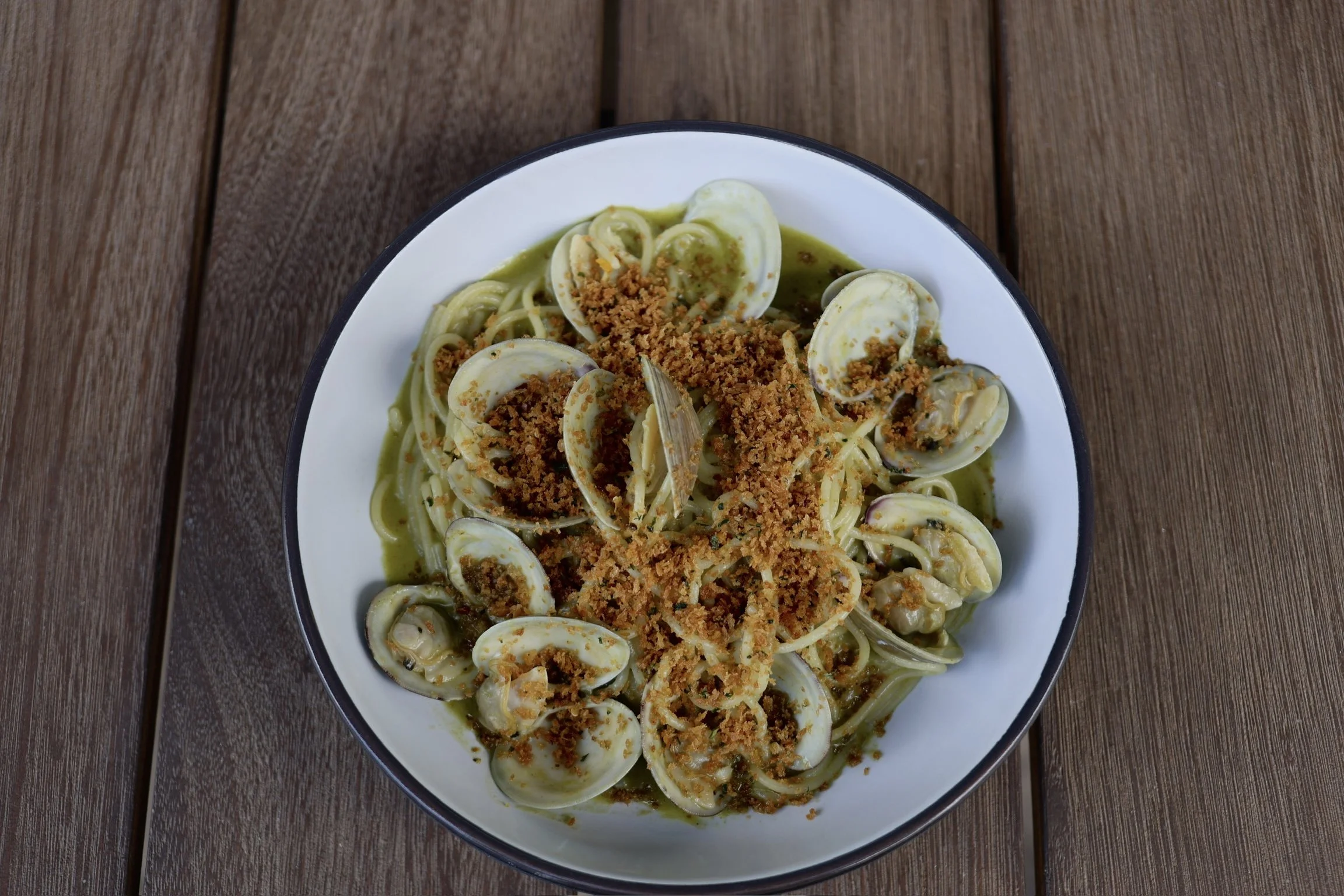SPAGHETTI in an creamy herb butter sauce with littleneck clams & topped with bottarga breadcrumbs 