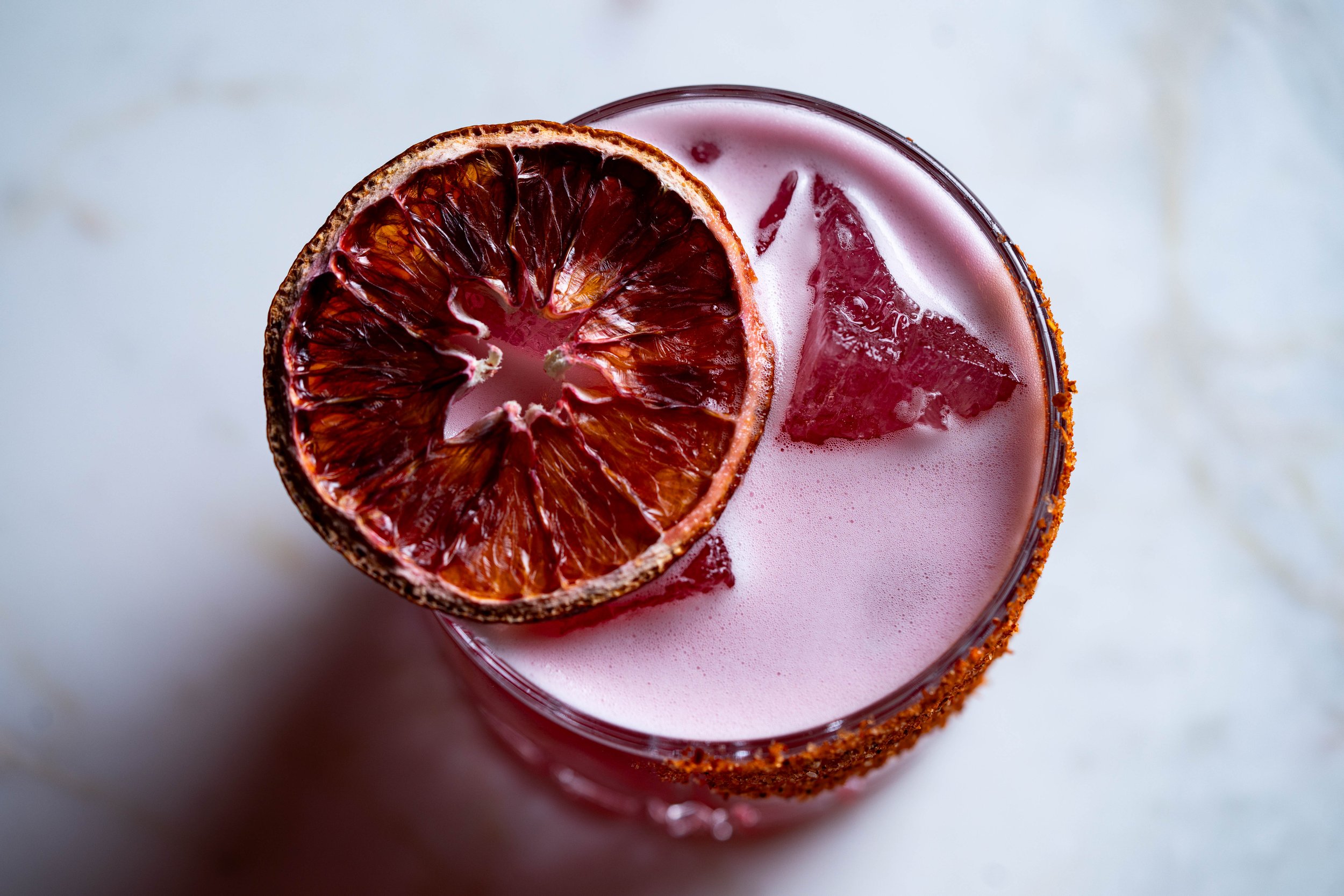 Blood Meridian - A spicy mezcal margarita with blood orange and ancho chili 