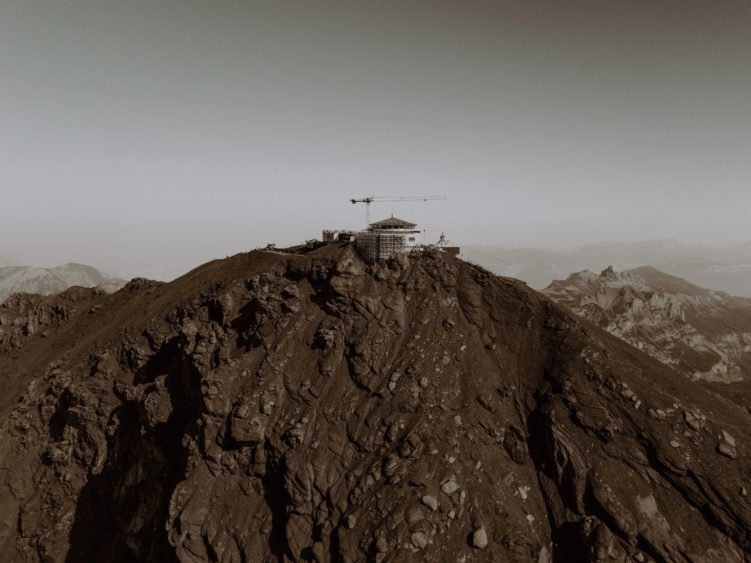 The majestic Schilthorn Piz Gloria of the Swiss Berner Oberland standing at the summit during the summertime.