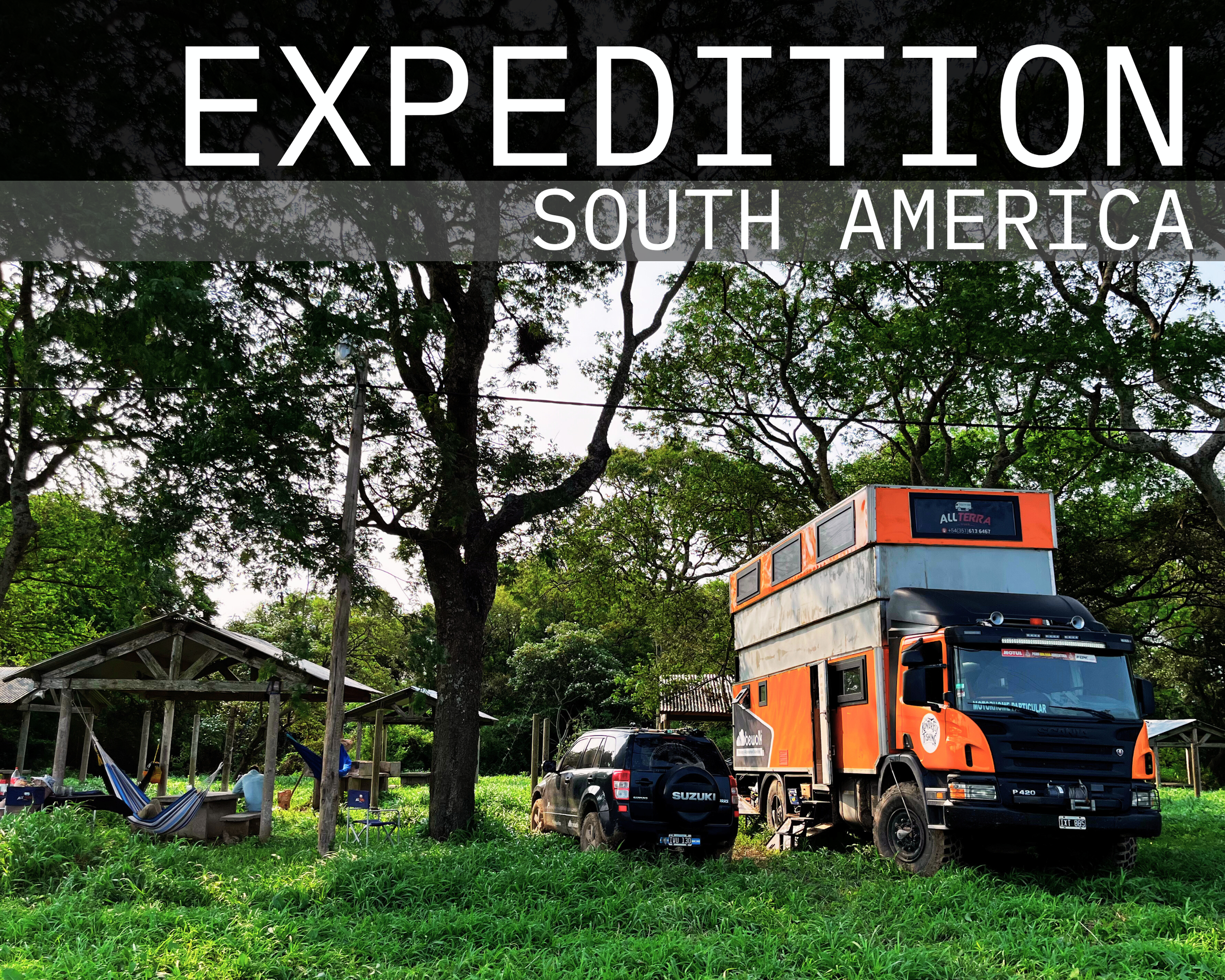 A large orange and black expedition vehicle parked on a grassy area under tall trees, with a black SUV nearby and a small wooden shelter with a hammock in the background. The text overlay reads 'EXPEDITION SOUTH AMERICA'.