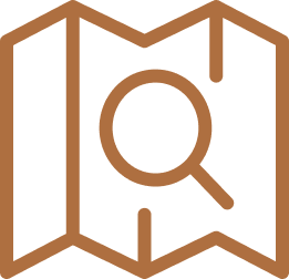 Icon of a magnifying glass over a folded map.