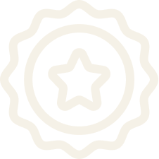 A black-and-white icon of a badge or medal with a star in the center.