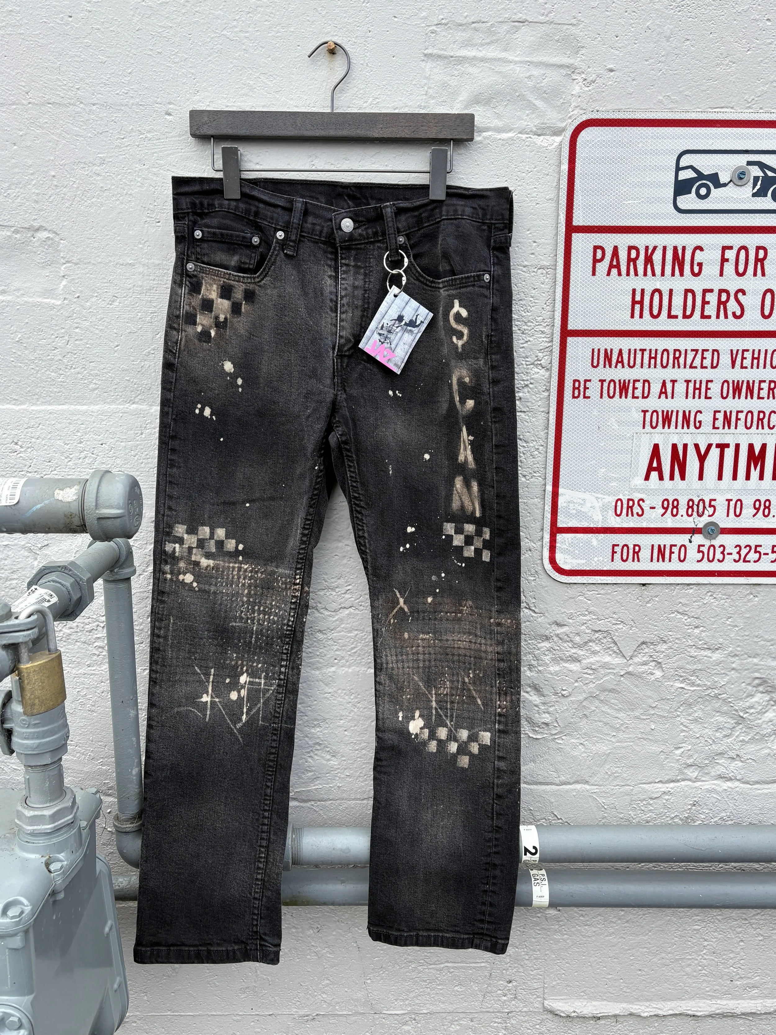 ‘$CAM’ Distressed Levi Jeans