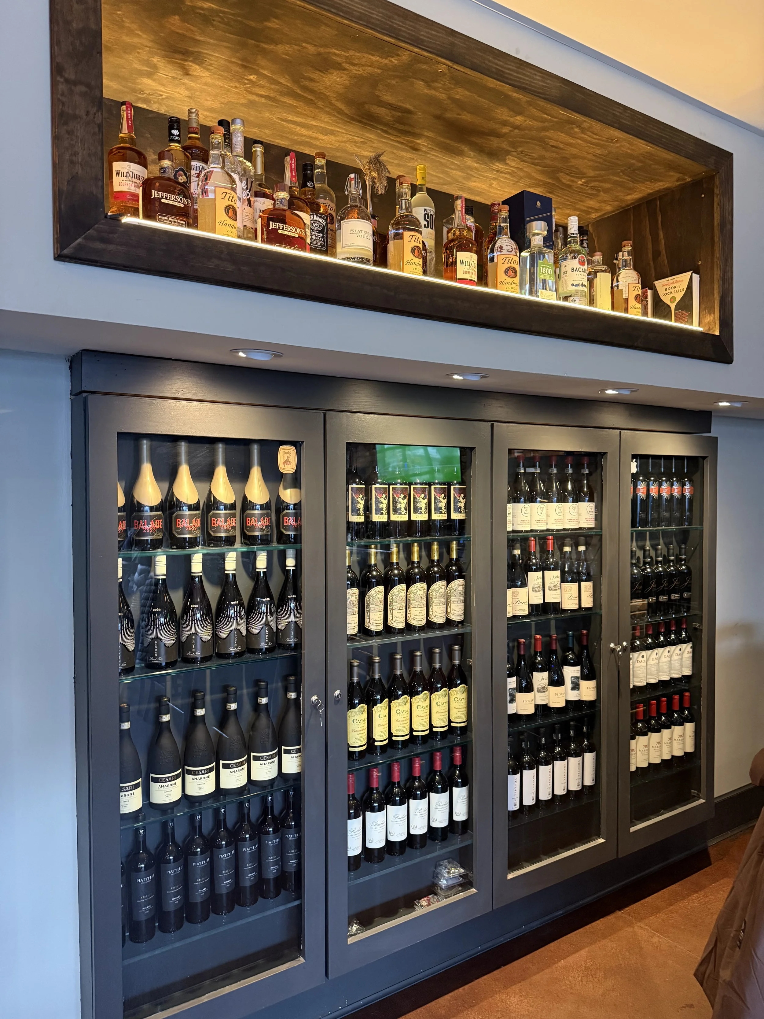 Elegant wall-mounted wine display featuring popular red wines at Duo Restaurant & Bar in Haddon Township, NJ