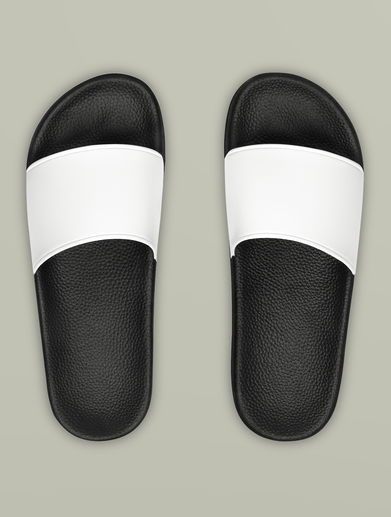 Pair of black and white slide sandals viewed from above on a light gray background.
