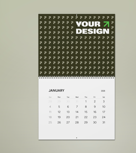 A 2026 calendar page for January 2026 with a black header area containing question marks and the text "YOUR DESIGN" with a green arrow pointing upward.