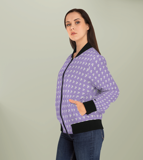 Woman wearing a purple jacket with white question marks on it, standing with one hand in her pocket, against a light green background.