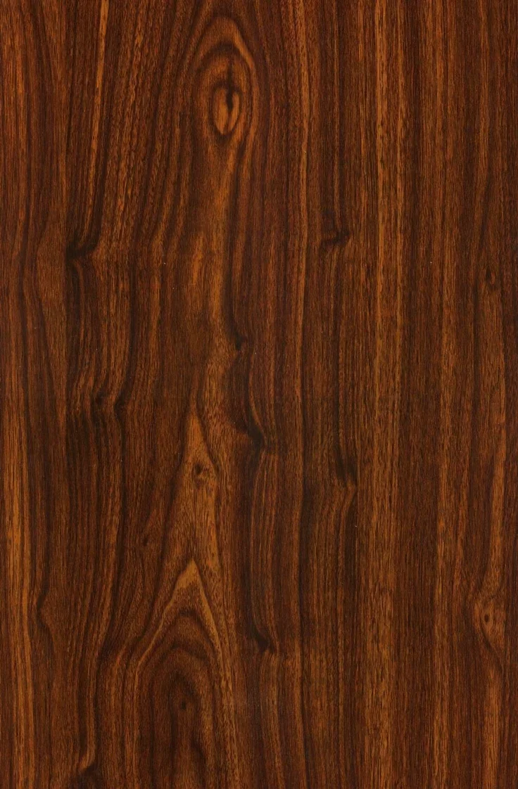 Close-up of a polished wooden surface with a rich brown grain pattern.
