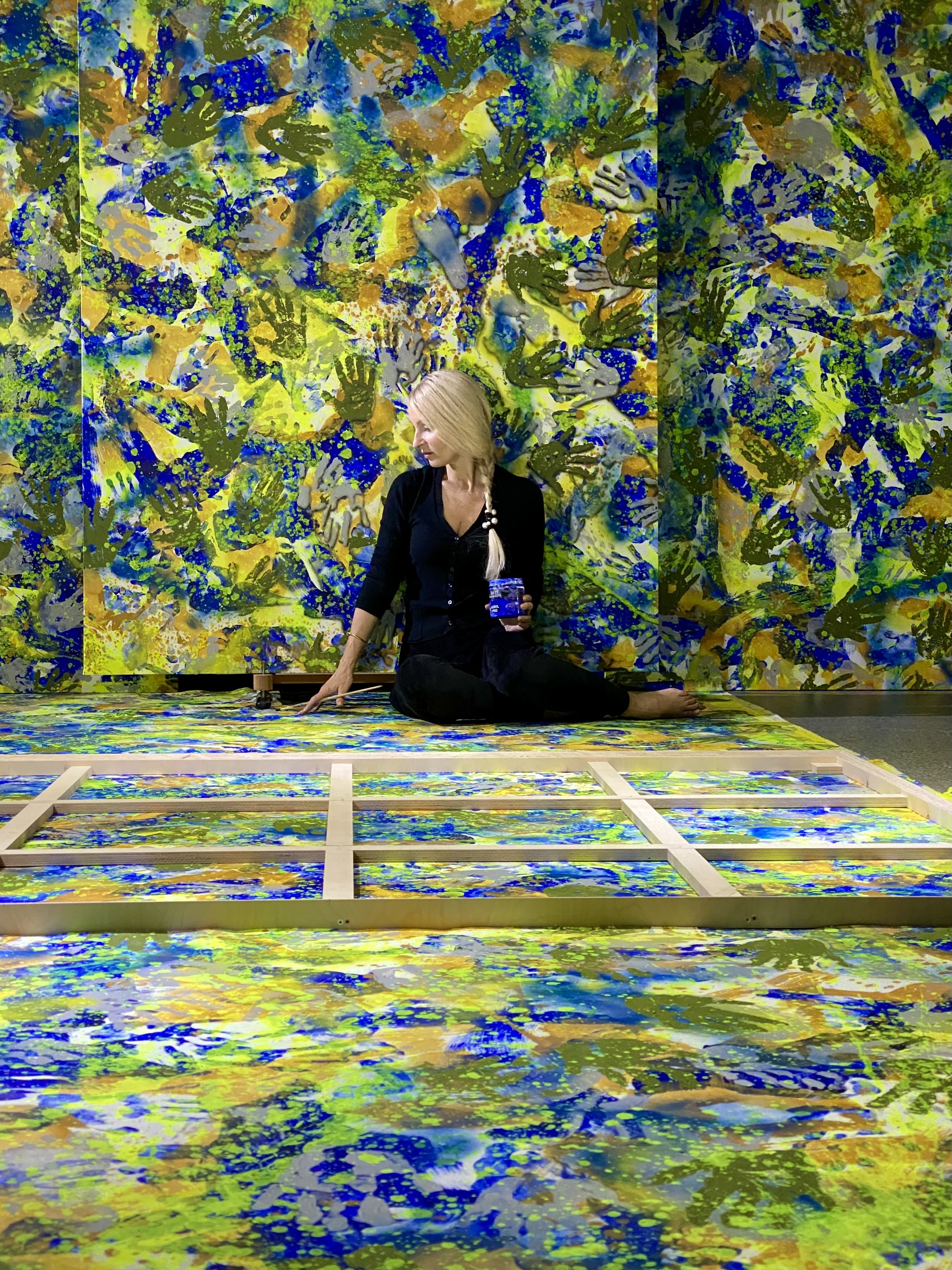 Iryna_Sushelnytska  _Artist within a monumental painted environment, showing the body as a measure of scale