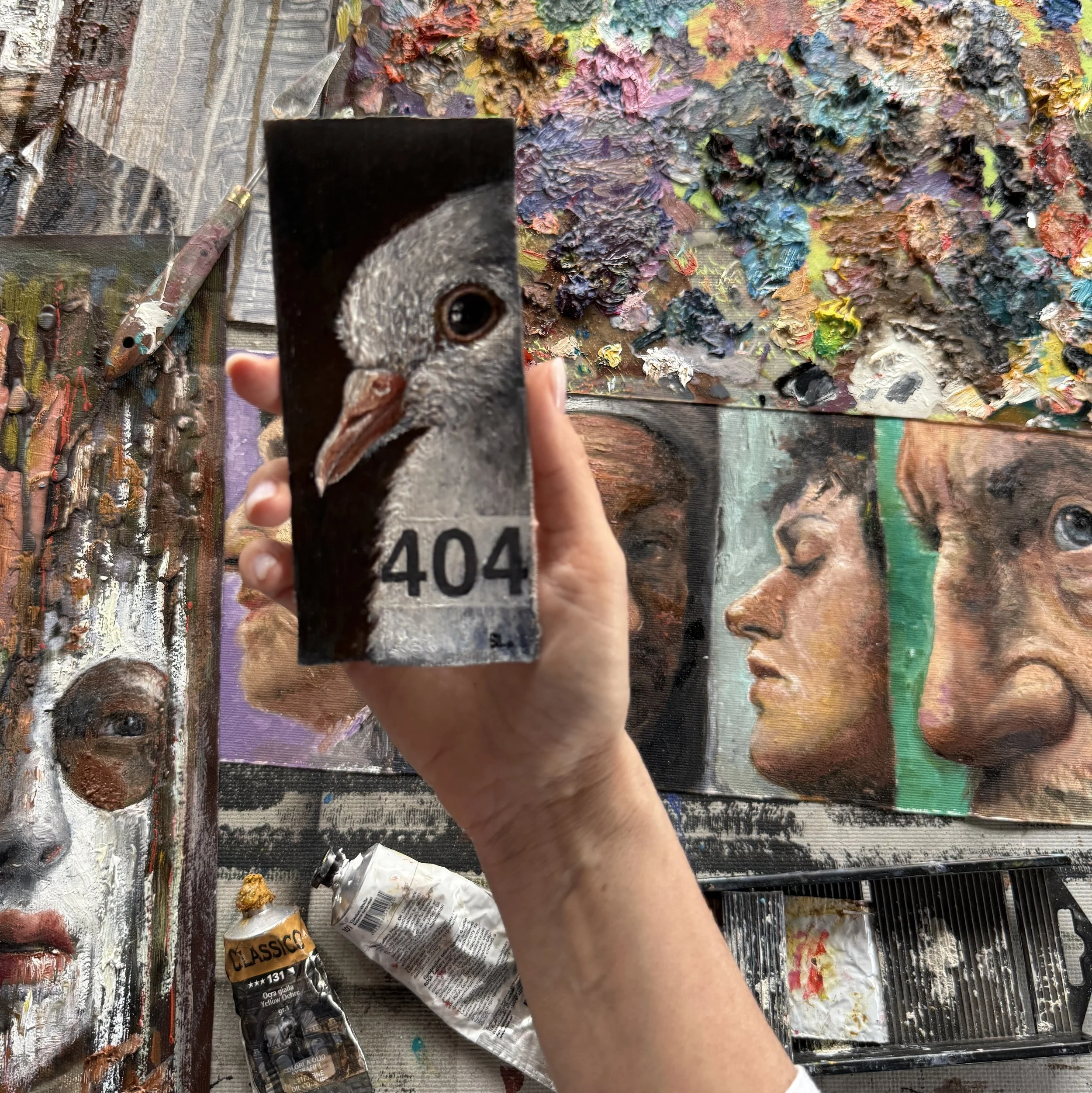 Small-scale artwork held in the artist’s hand, showing the relationship between form and human scale