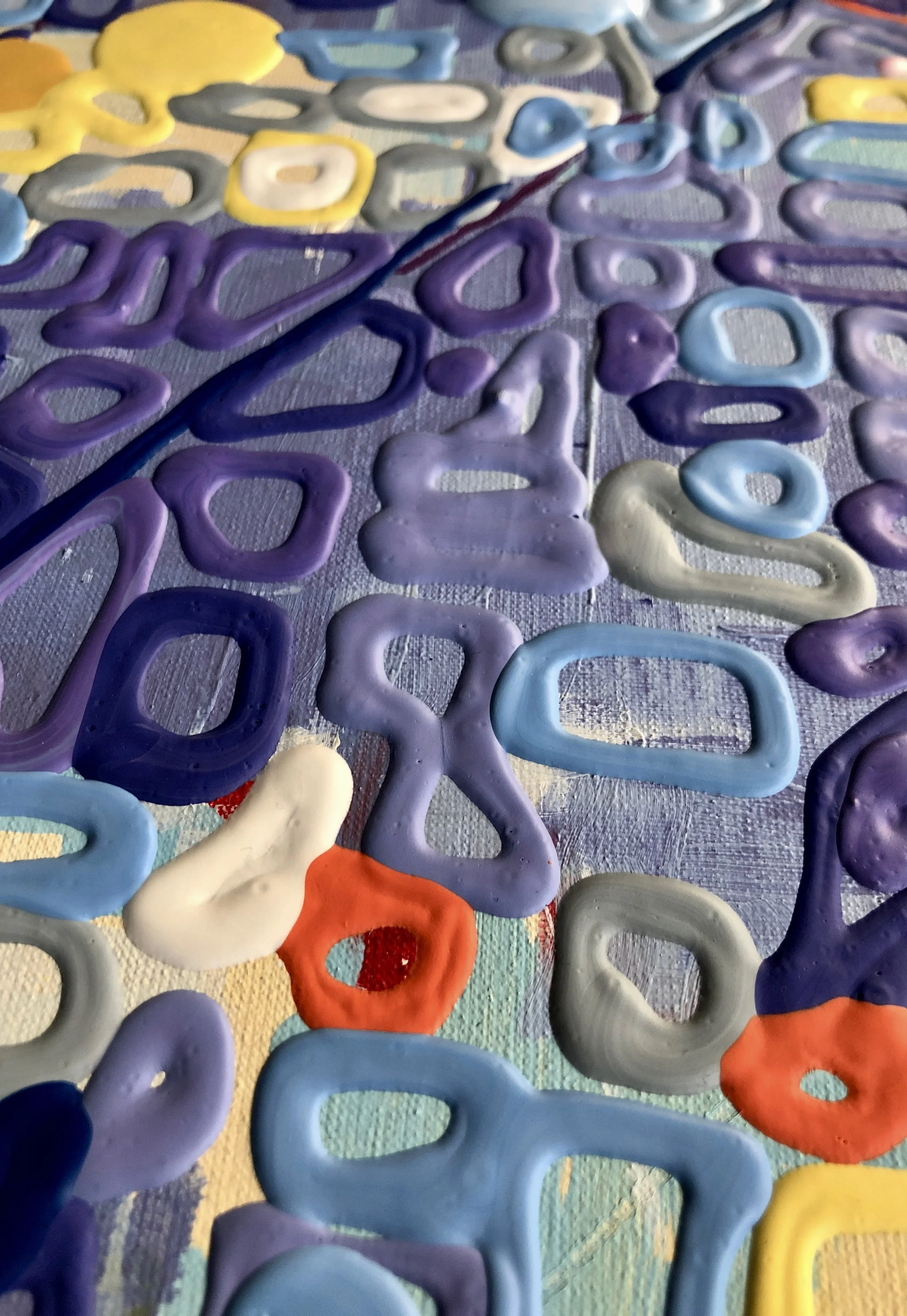 Paint built into raised forms, extending the pictorial surface into physical space