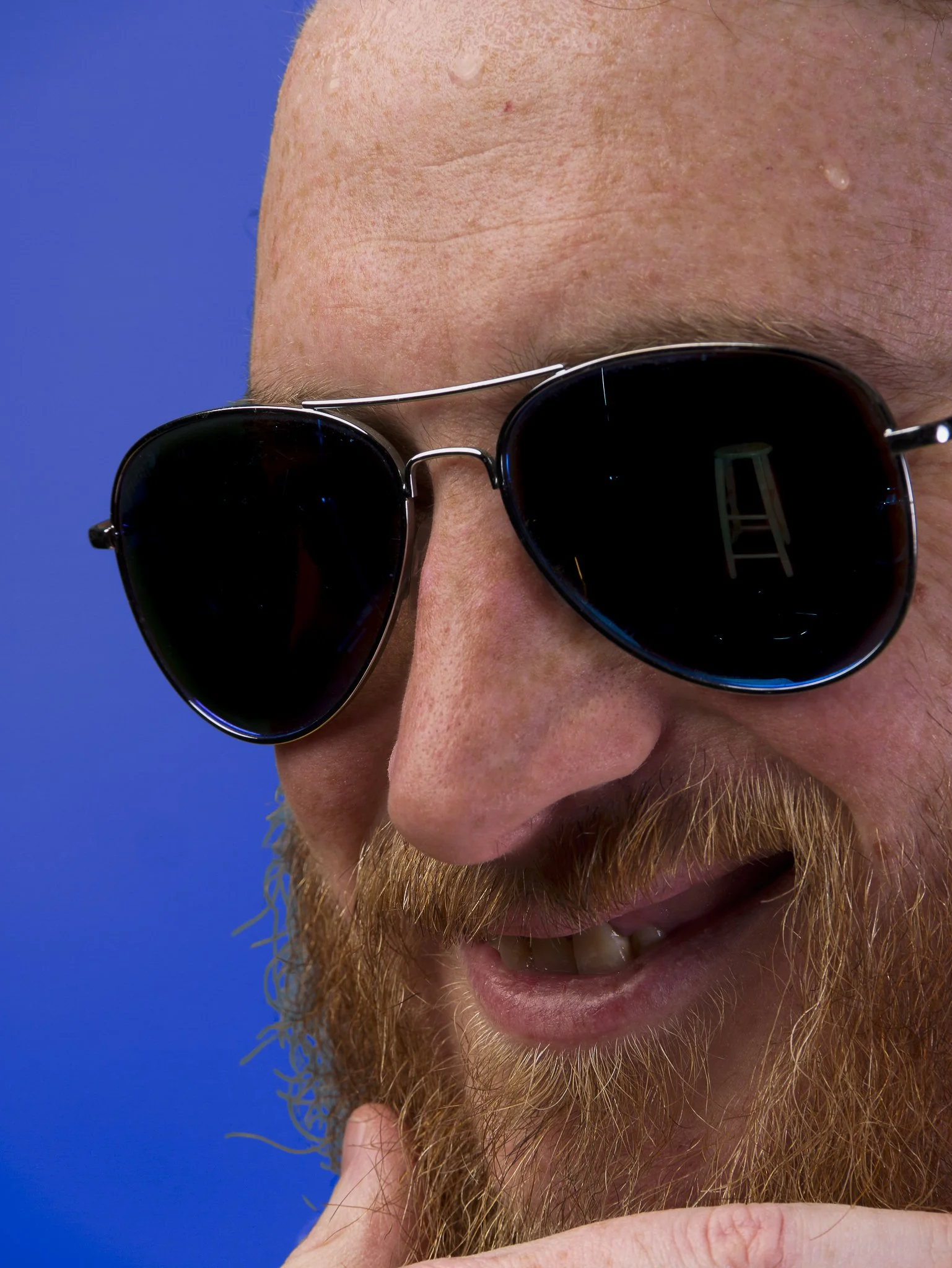 Onion, guitar player for Bard City, with his mimic (barstool) girlfriend reflected in his sunglasses