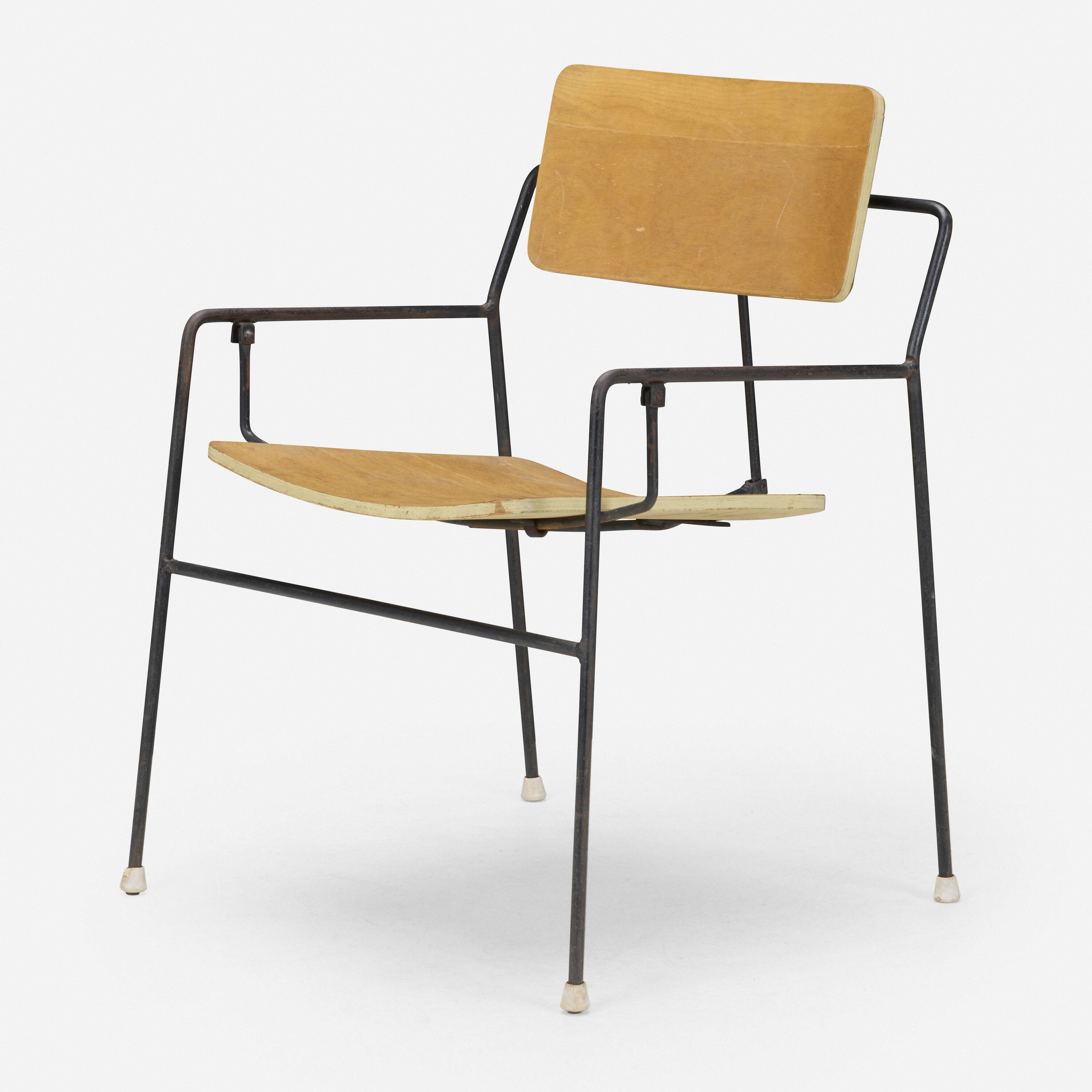 A vintage wooden and metal chair with a curved wooden seat and backrest, metal legs, and white rubber feet, positioned against a plain white background.